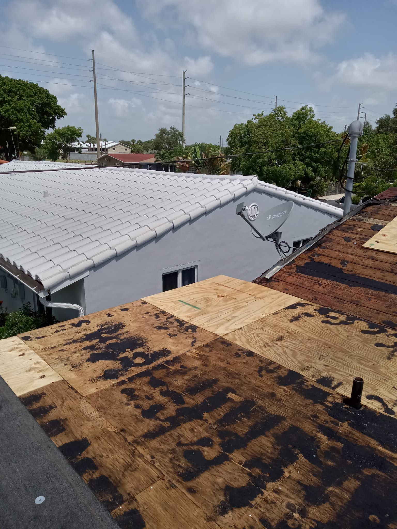 Standing Seam Metal & Flat Re-Roof using 1.5" Nail Strip 24ga Black Matte Kynar Coated Standing Seam Metal Panels by Morton Roofing, Inc.