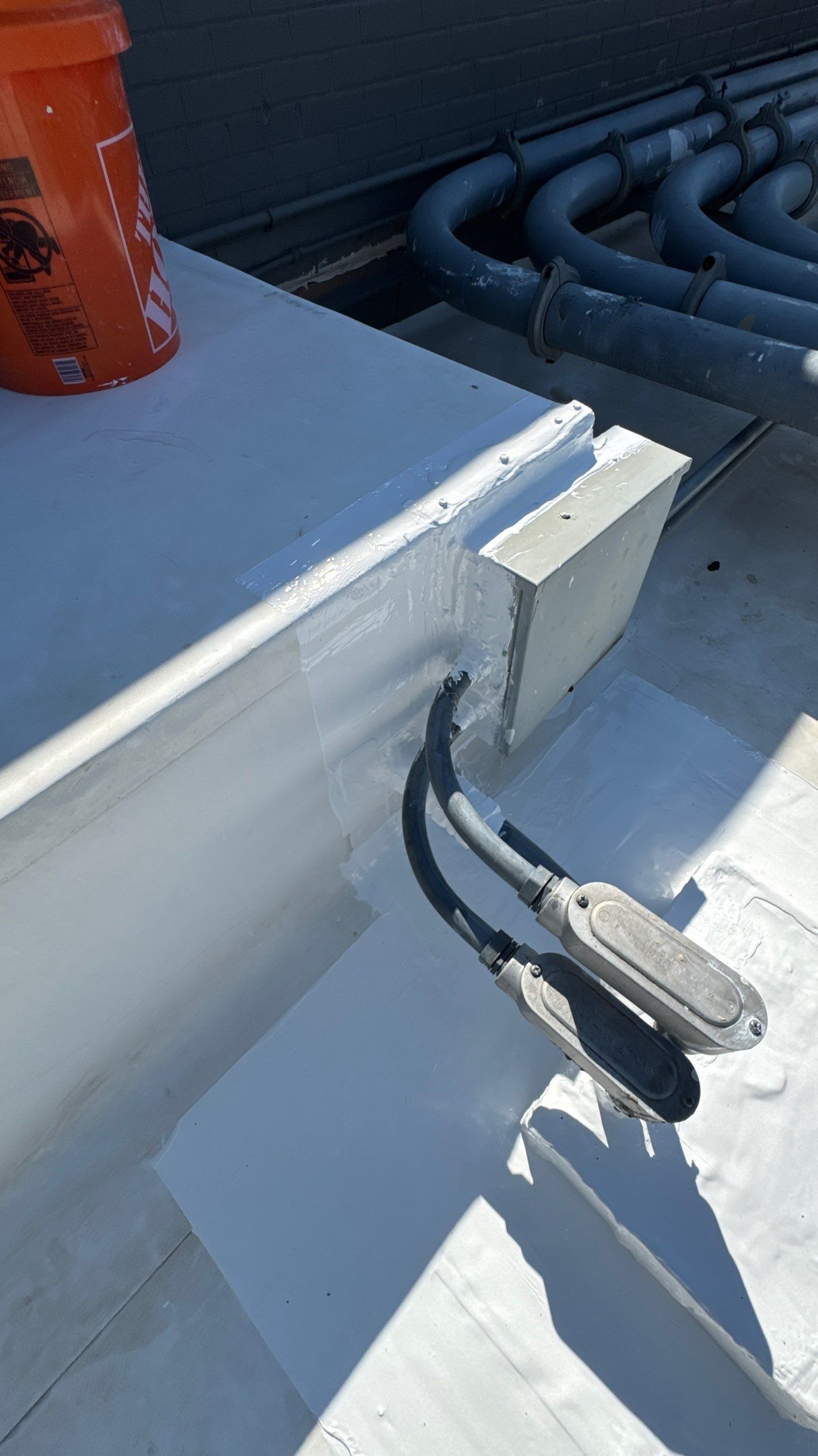 Commercial Roofing Repair using TRP #924 Eterna-Sil Premium Silicone Roof Coating by Harvey Roofing & Construction