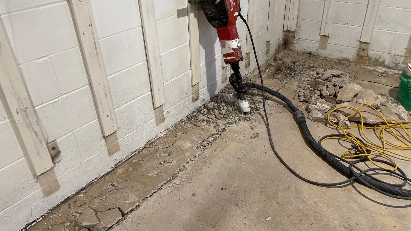 Interior Drain Tile & Buried Discharge in St. Anthony, MN by Waterproofing Northeast