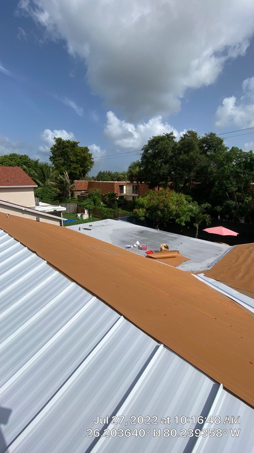 Residential Roofing Installation using 1.5" Nail Strip 24ga Solar White Kynar Coated Standing Seam Metal Panels by Morton Roofing, Inc.