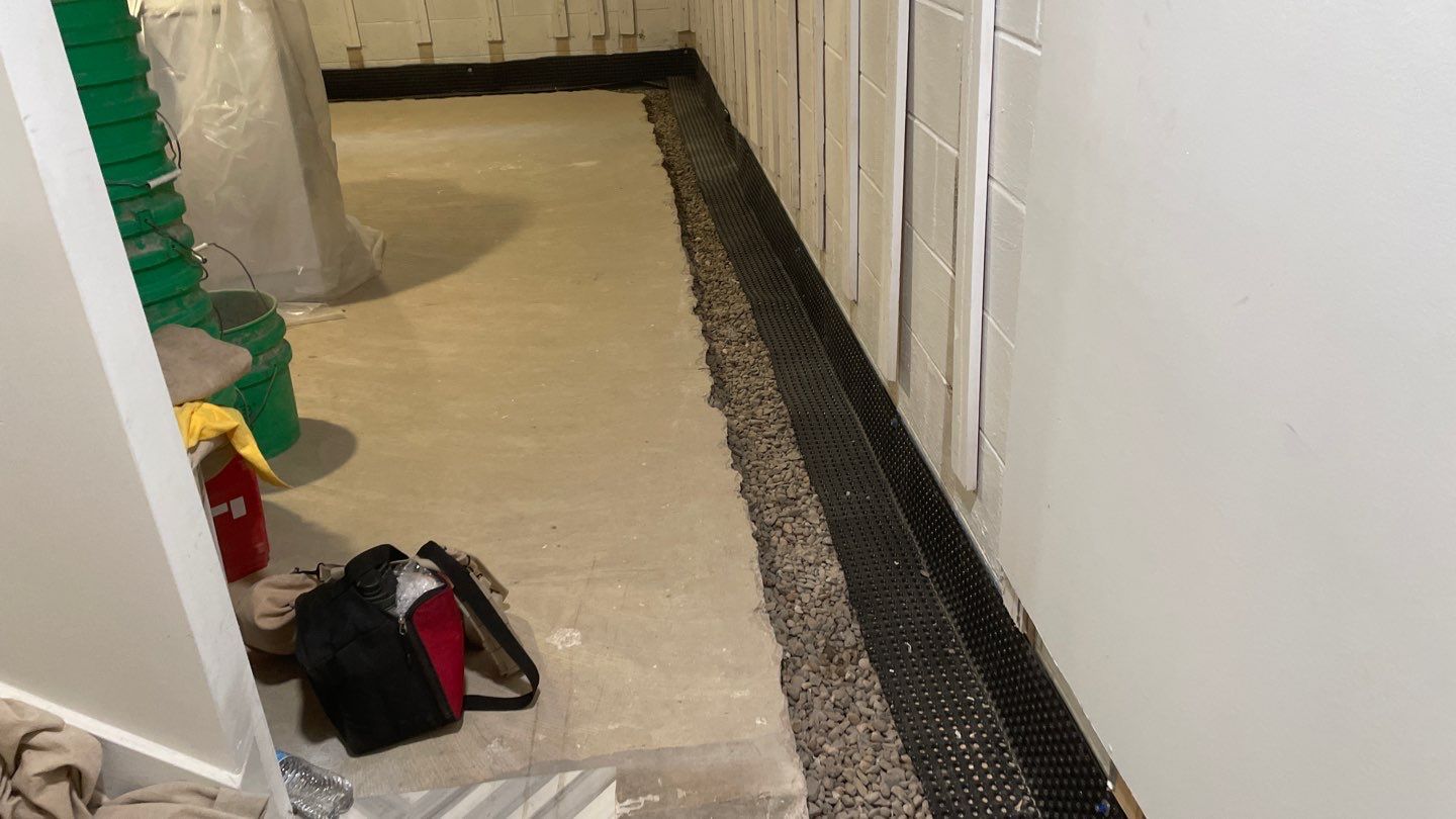 Interior Drain Tile & Buried Discharge in St. Anthony, MN by Waterproofing Northeast