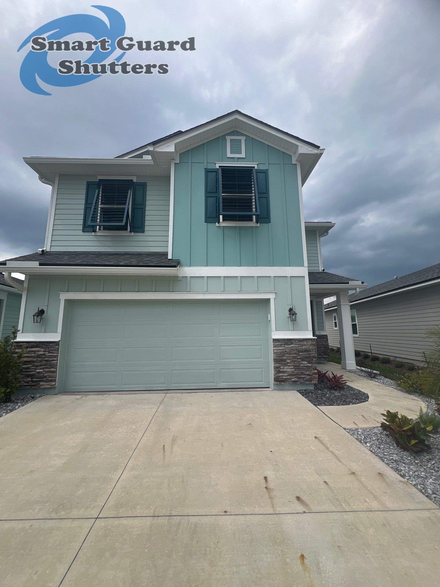 Impact Bahamas in Ocean Blue, Accordion in White by Smart Guard Shutters