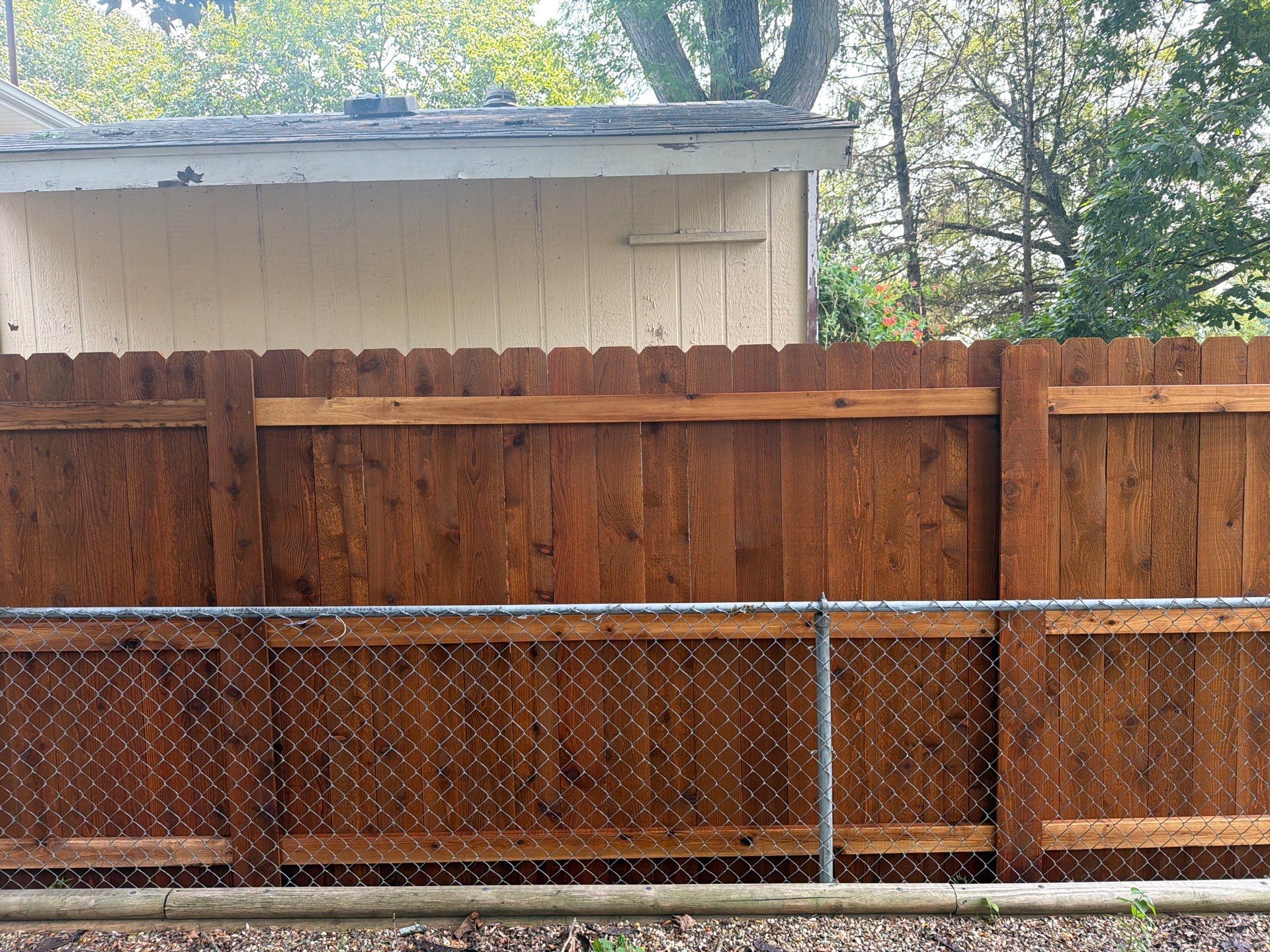 Pecan Cedar Privacy Fence Installation with Scalloped Top in Cedar Falls by Perfect Picket Fence and Stain