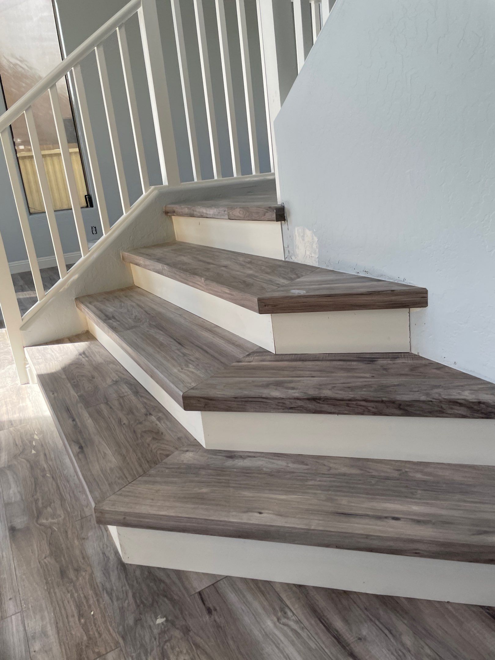 Laminate Staircase and Flooring  by Footprints Floors of Chandler 