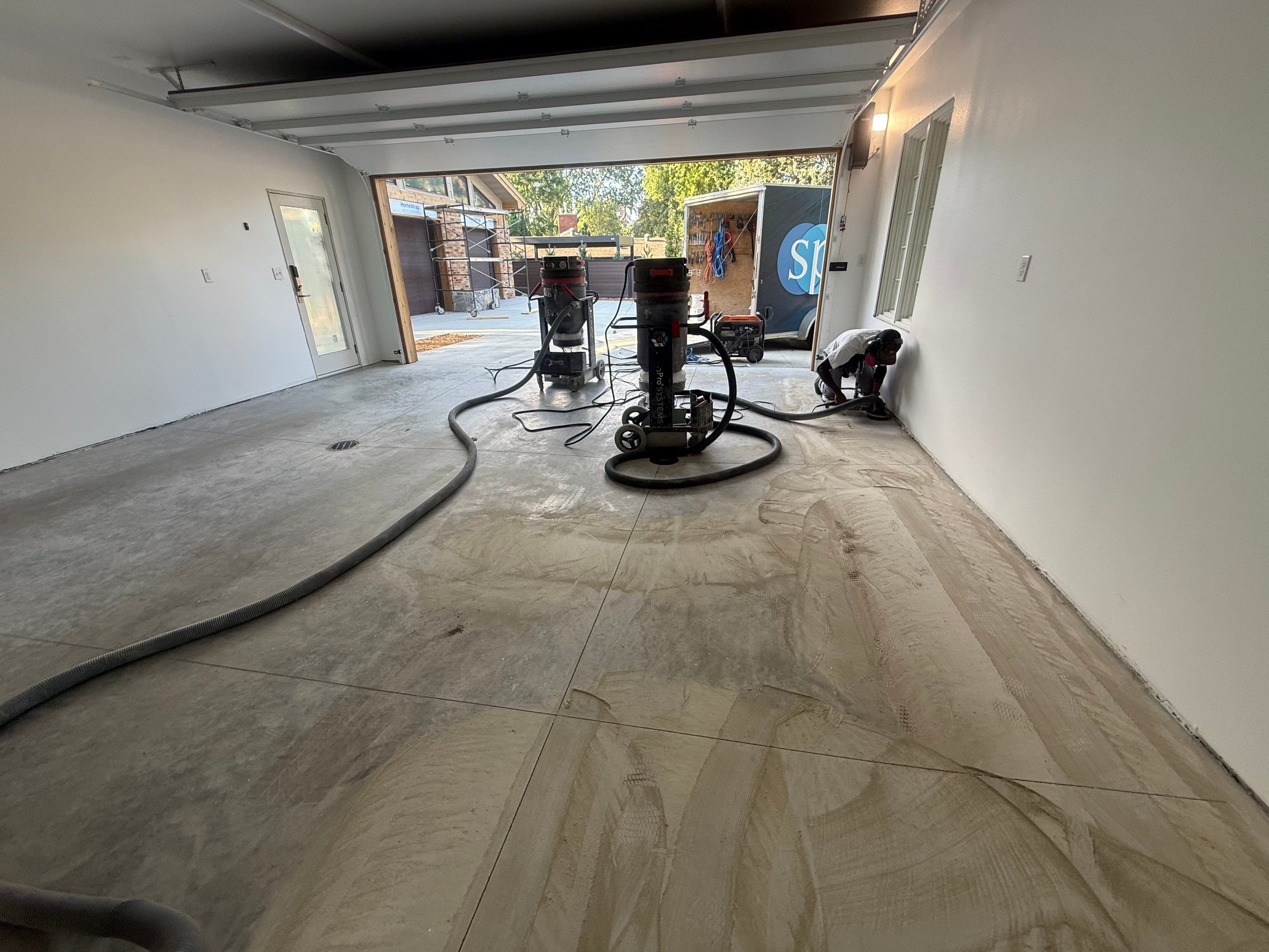 Multi-Car Garage Floor Coating Installation in Sioux Falls by Select Painting, Coatings & Garage Cabinets