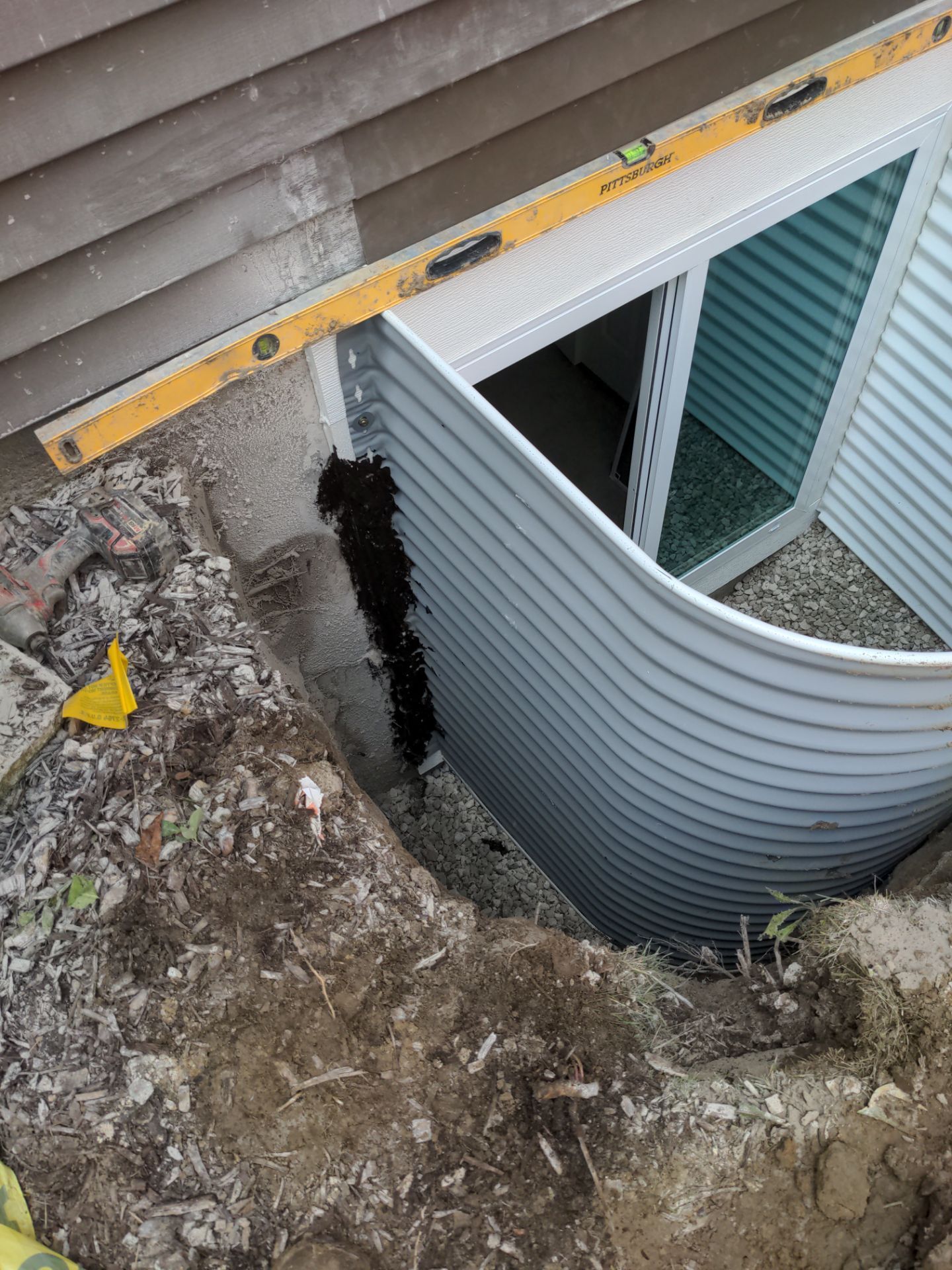 Interior Basement Waterproofing System and Egress Window Installation by Toledo Basement Repair 