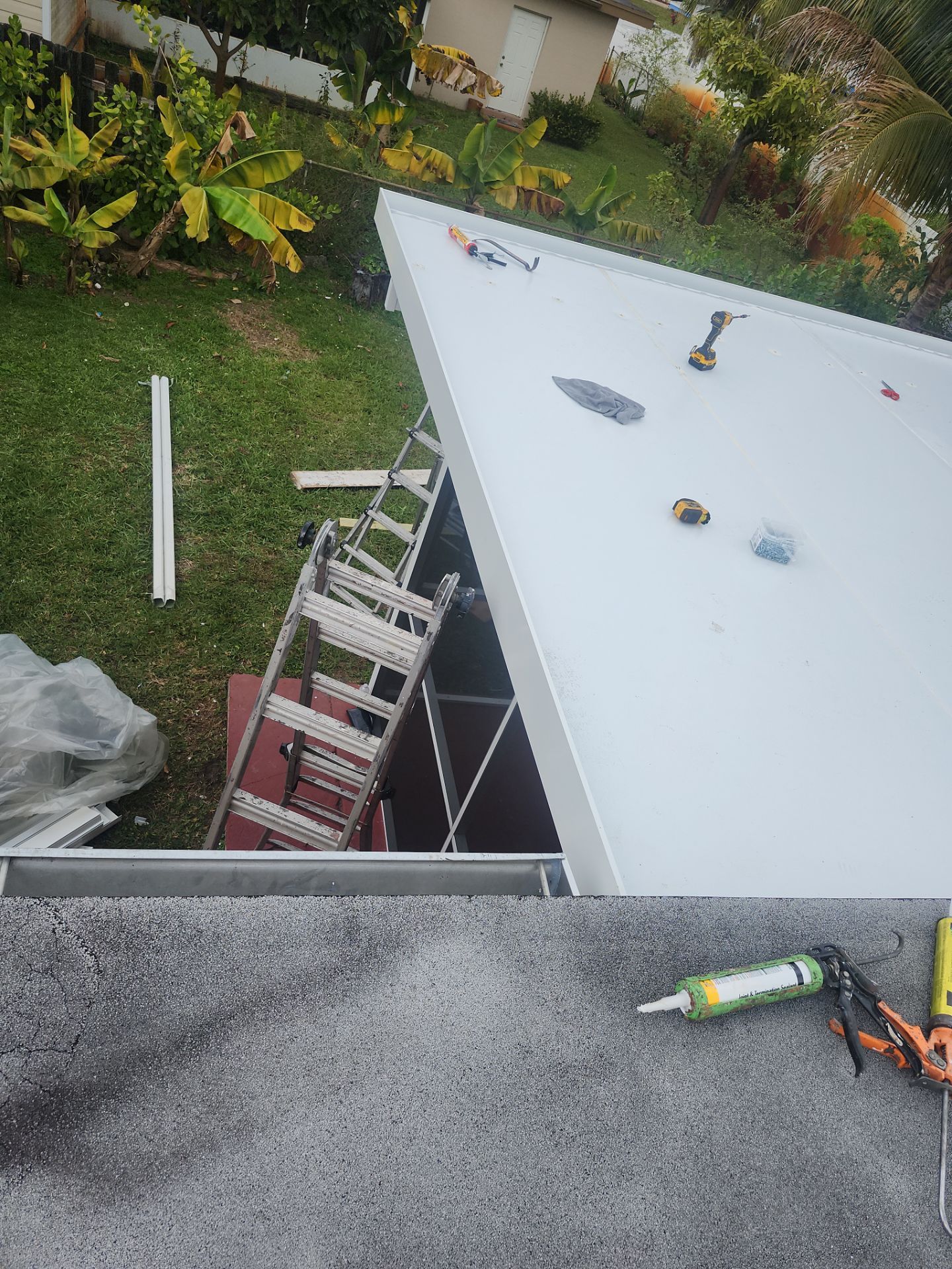 Insulated Screen Enclosure and Wood Tile Deck Installation in Plantation by Aastro Roofing