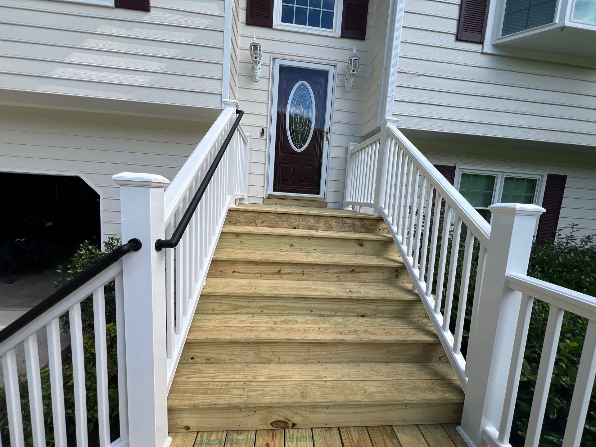 Front Entrance Deck Stair Replacement with White Vinyl Railings in Lawrenceville by Swift Home Renovations