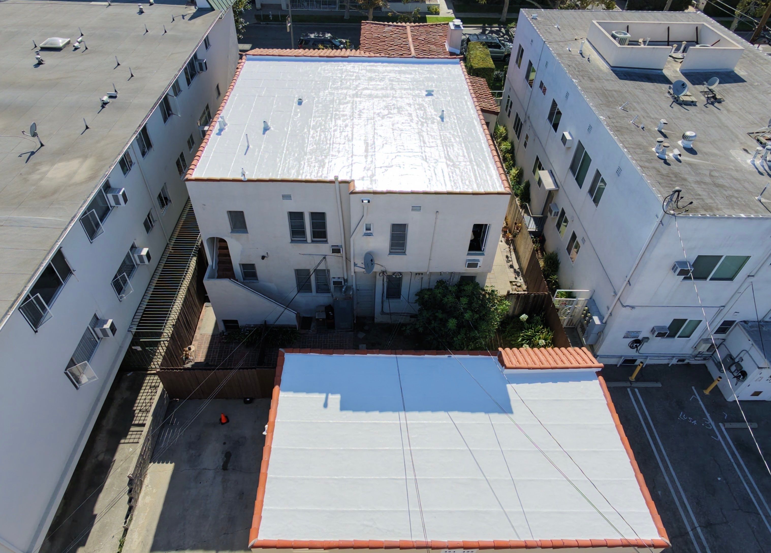 Beverly Hills Flat Roof Coating and Terracotta Tile Reset by Hull Brothers Roofing
