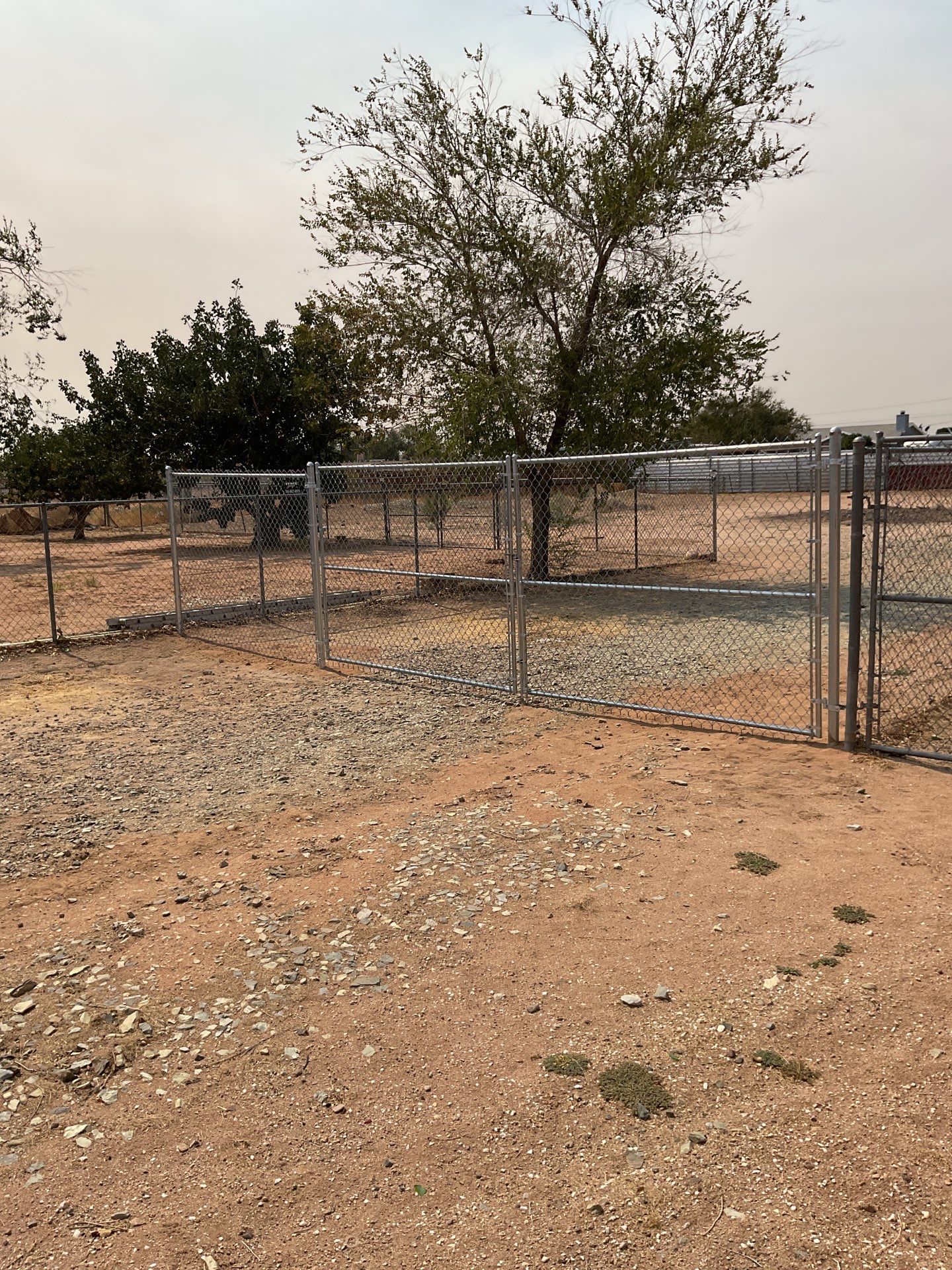 Gate installation using chain -link by Fence Guys Inc.