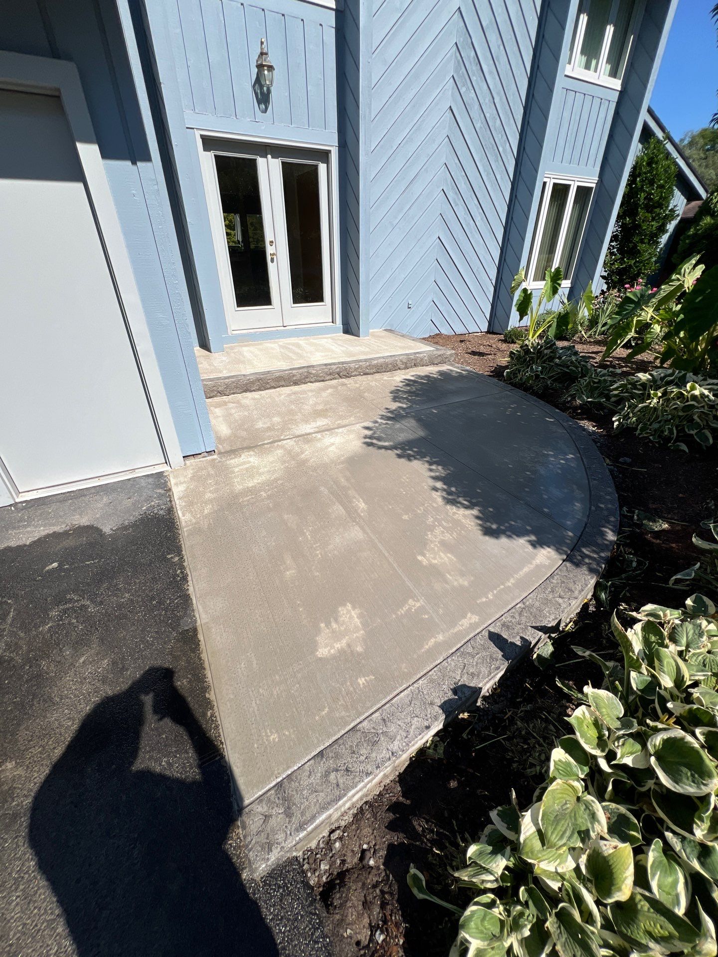 Charcoal Release Border with Broom Finish  by NG Masonry & Construction LLC