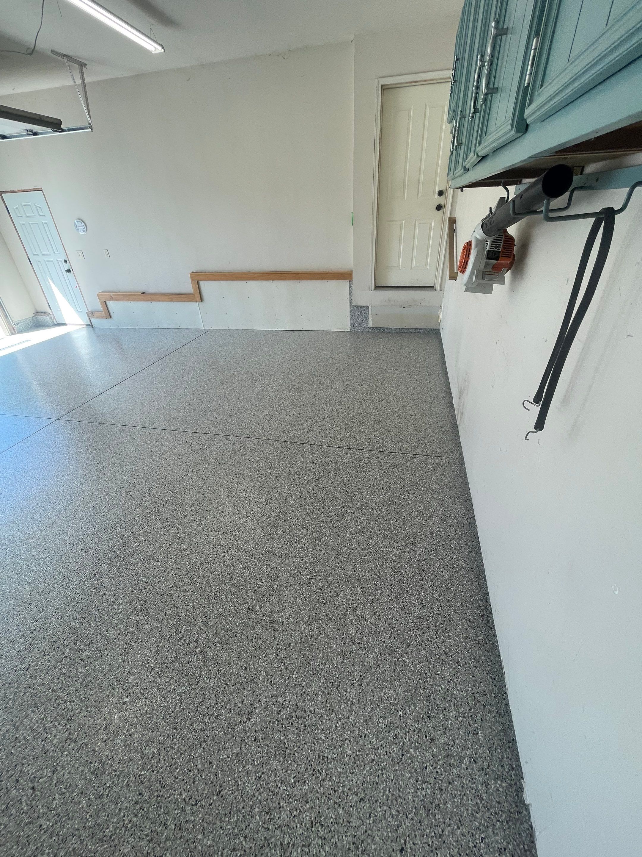Multi-Stall Garage Floor Coating Installation in Sioux Falls by Select Painting, Coatings & Garage Cabinets
