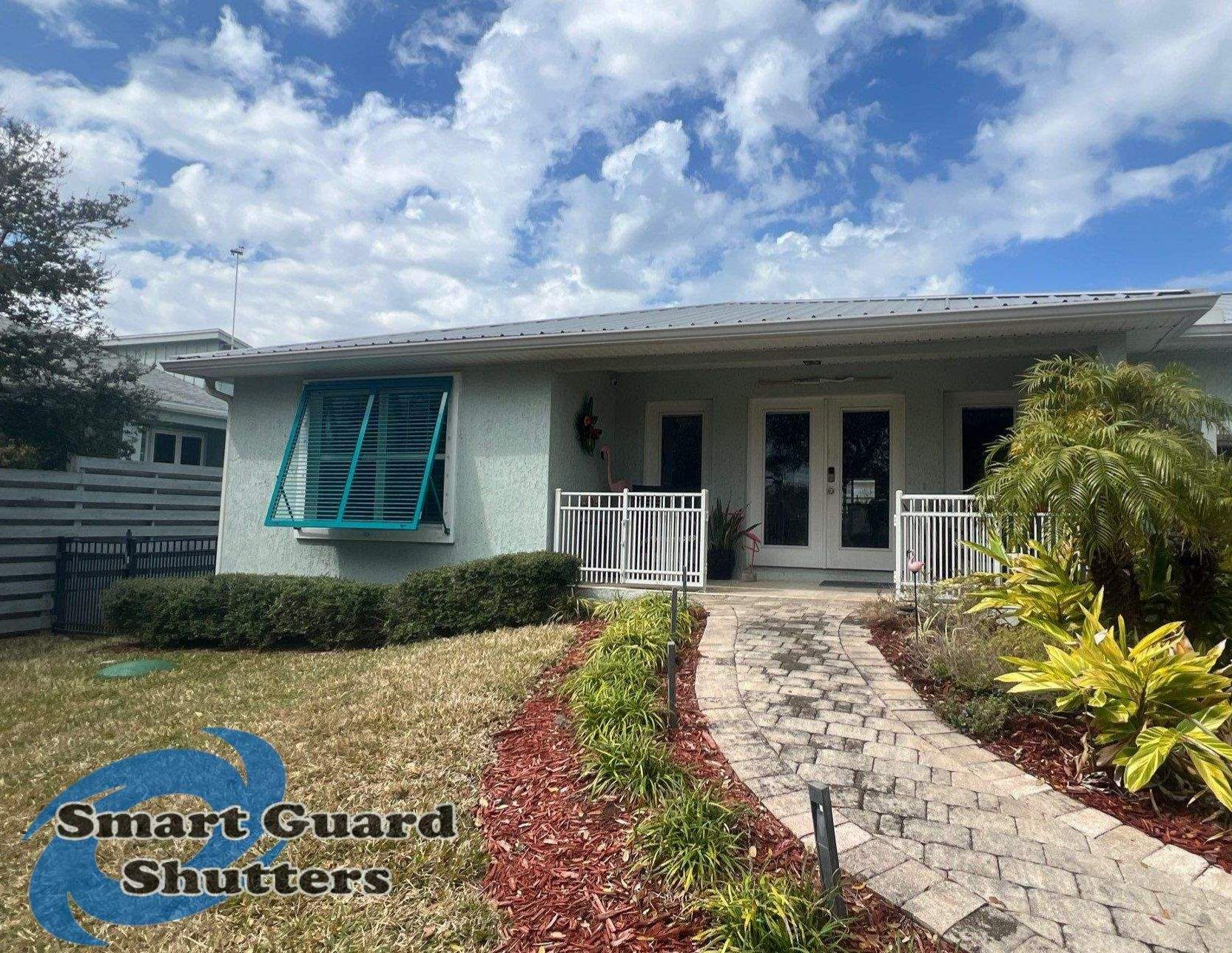 Impact Bahama Shutters in Water Blue by Smart Guard Shutters
