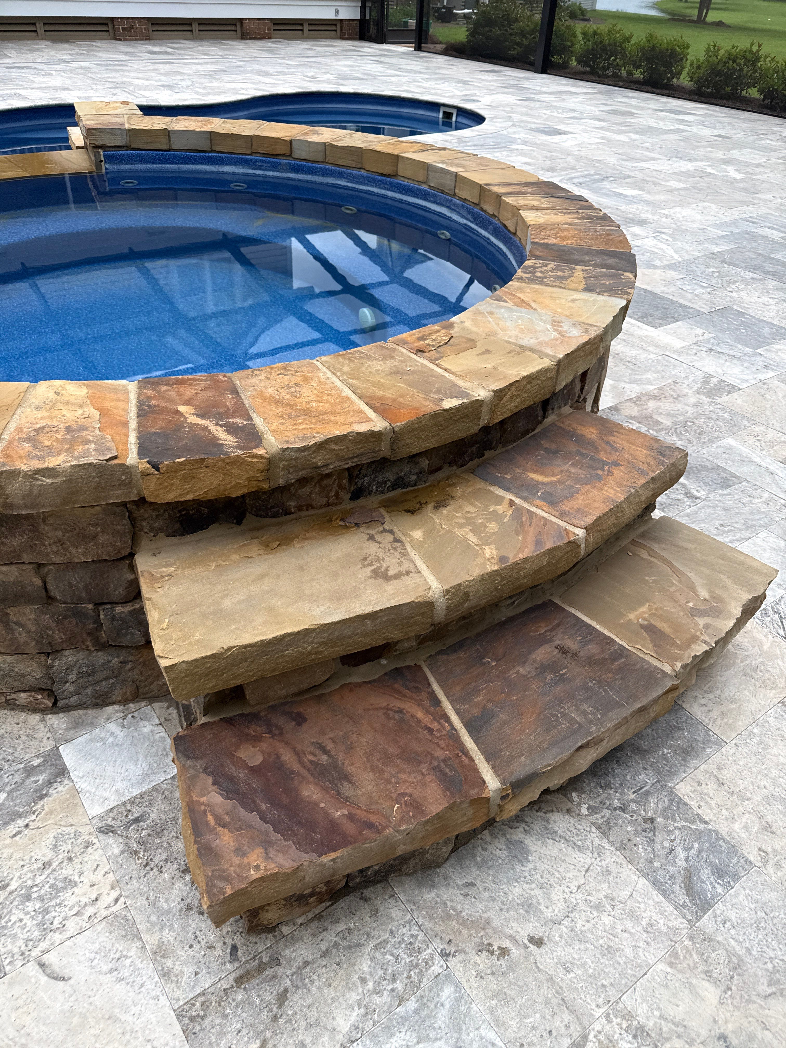 Travertine Patio and Natural Stone Spa in Brantley by Cornerstone Hard Surface Restoration 