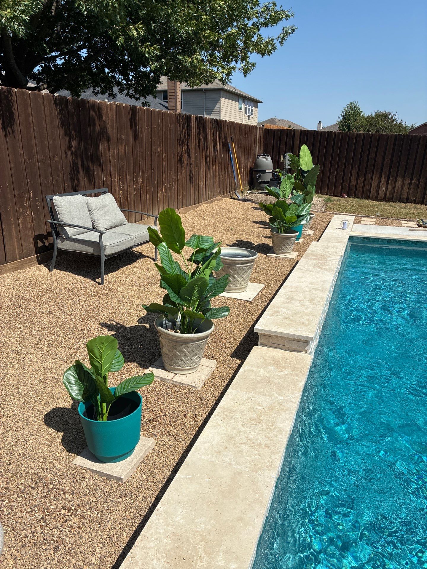 Modern Geometric Pool with Travertine Coping and Lush Landscaping by Pinnacle Pools and Spas - DFW