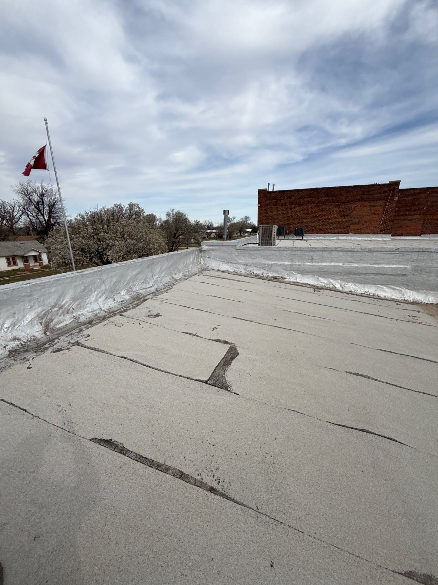 Hollis High School Comprehensive TPO Roof Replacement and Restoration by Secondary Rhodes