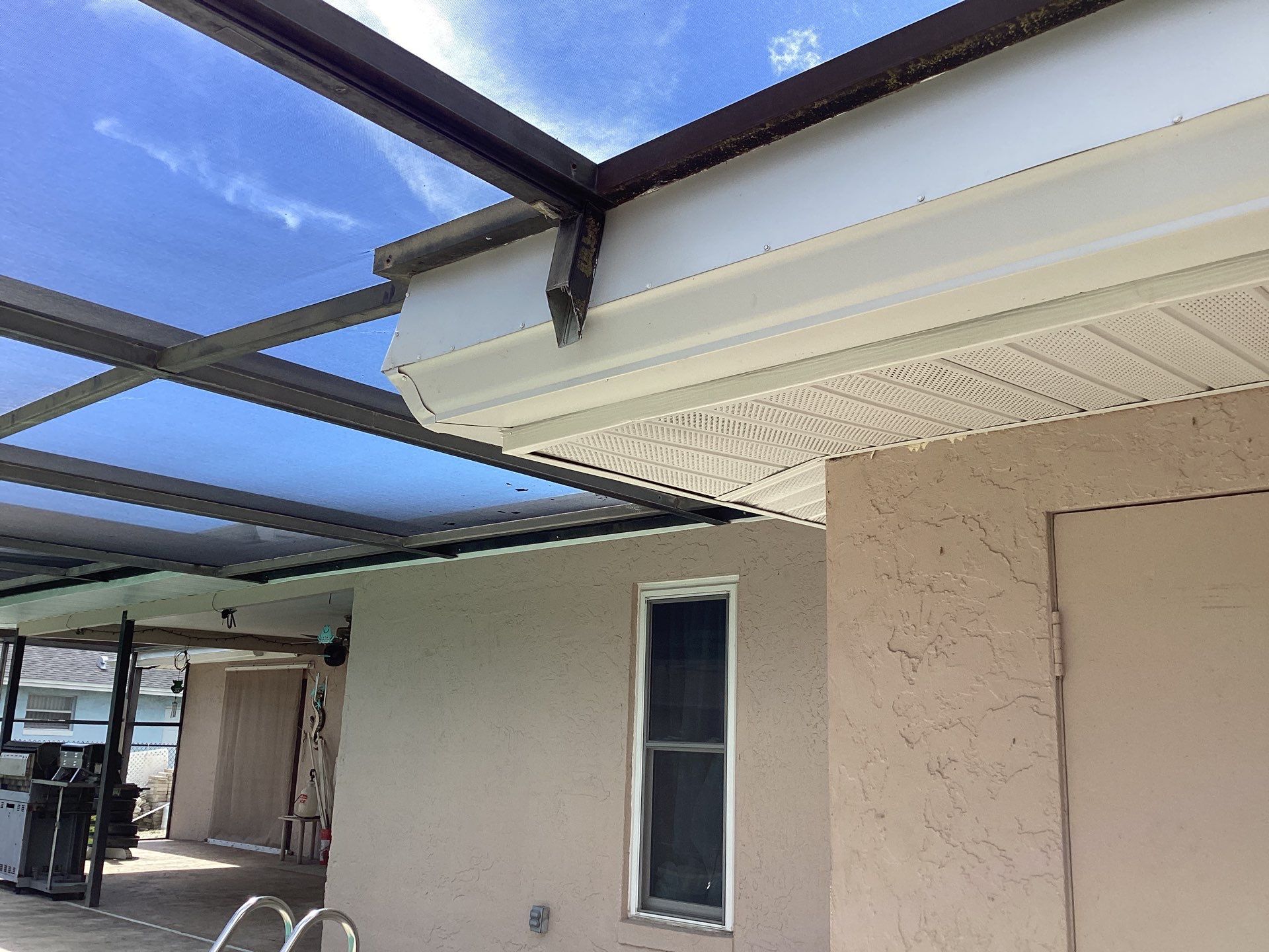 White Seamless Gutters and Splash Guards in Fort Myers FL by Gutter Professor by Gutter Professors