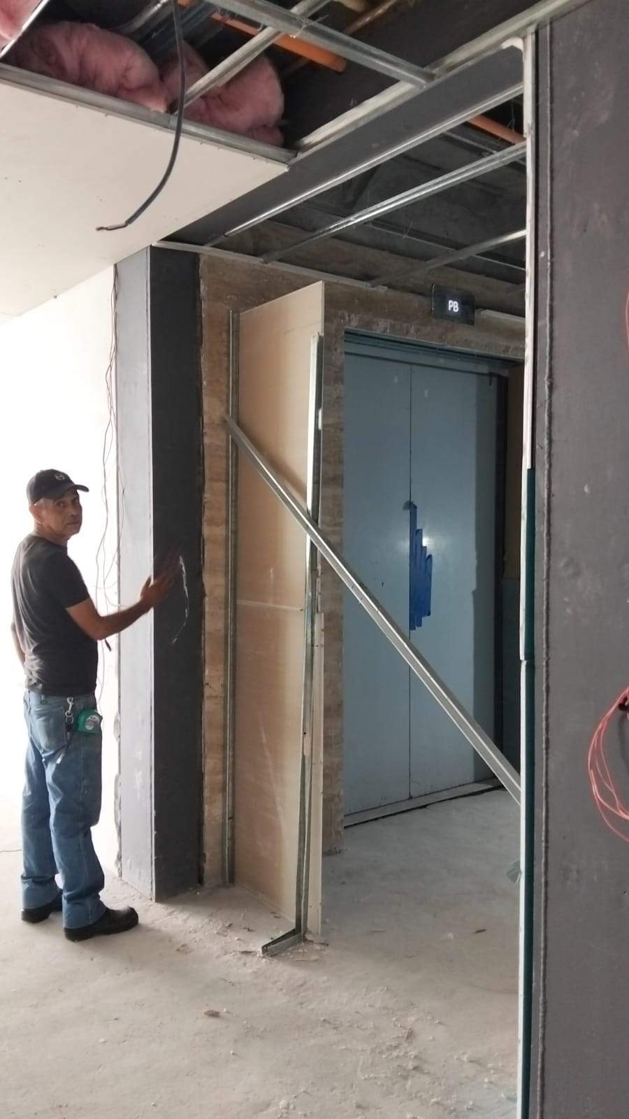 Modern Black Frame Double Door Installation with Custom Radial Hardware by Solara Custom Living