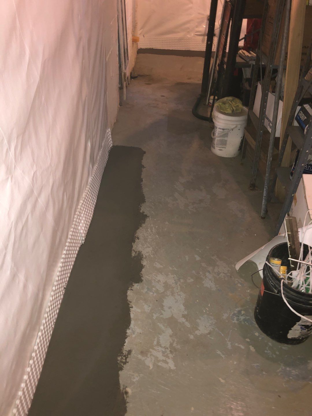 Basement Waterproofing using Drain tile system and a foundation wrap by ACE Waterproofing & Basement Solutions