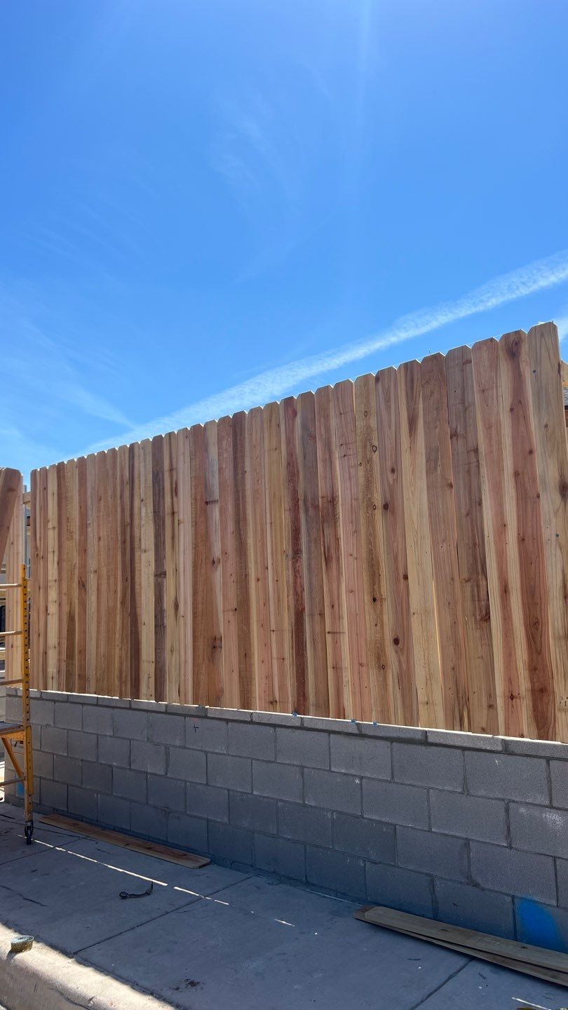 Cedar Fence using Cedar Pickets and Metal Poles by Clays Services Inc