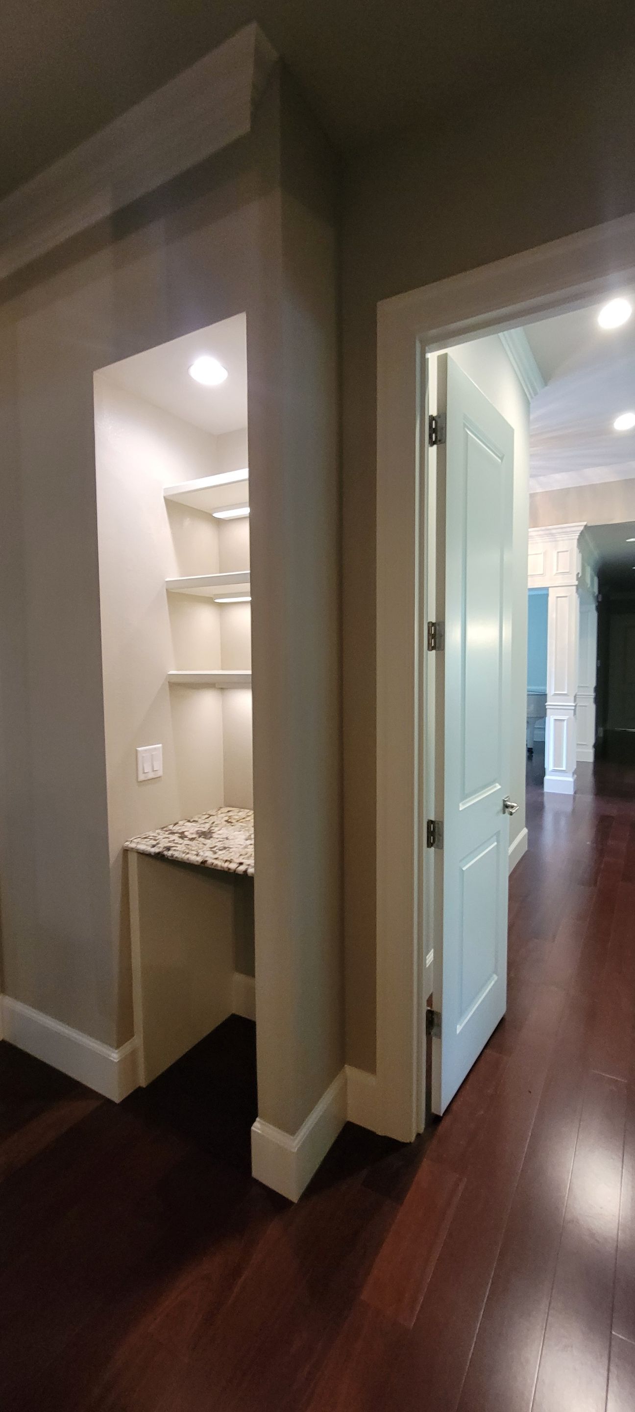 Closet transformation to coffee nook with custom shelves and LED lighting. by Crm Services Llc