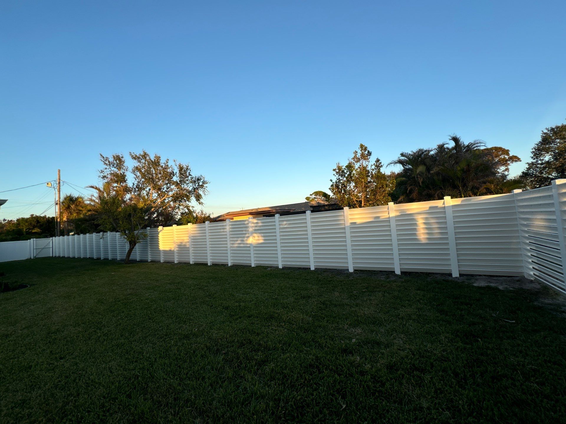 Vinyl Fence Installation using 6Ft Professional Grade White Vinyl Louvered Privacy Fence by Asap fence and gates, LLC