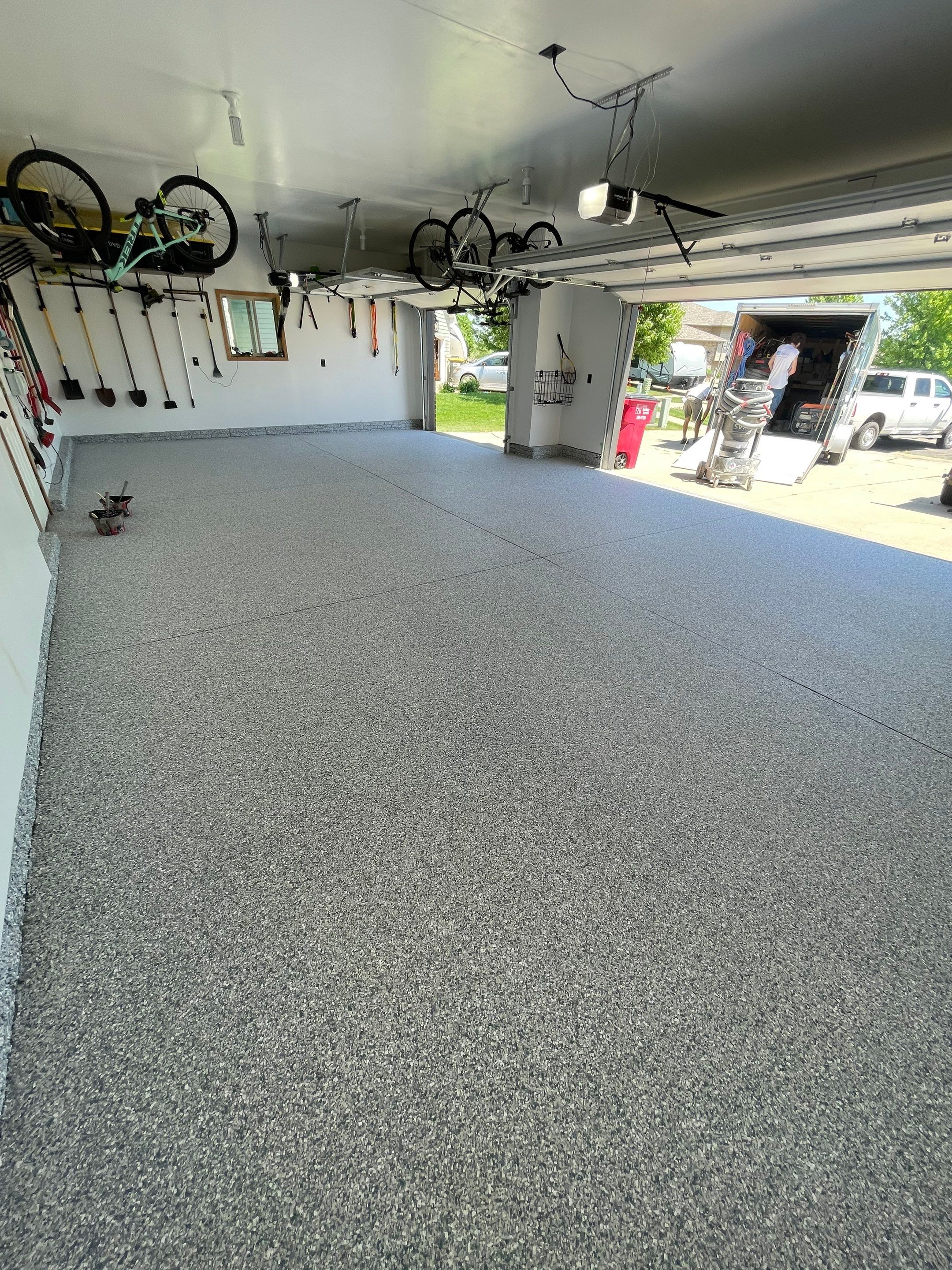 Tidal Wave Flake Garage Floor Installation in Sioux Falls by Select Painting, Coatings & Garage Cabinets