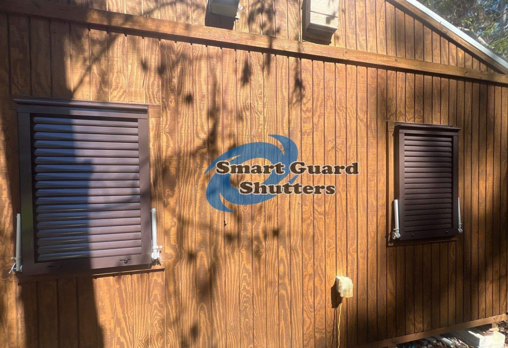Hurricane Protection in Bronze/Grey Brown by Smart Guard Shutters