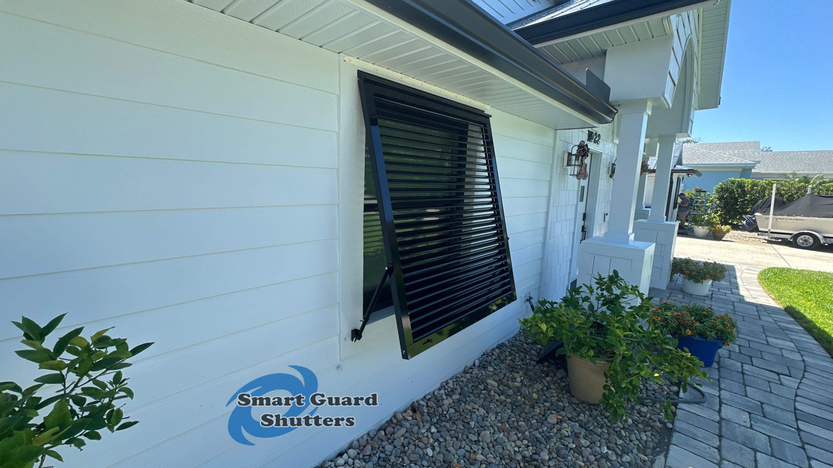 Impact Bahama Shutters in Jet Black by Smart Guard Shutters