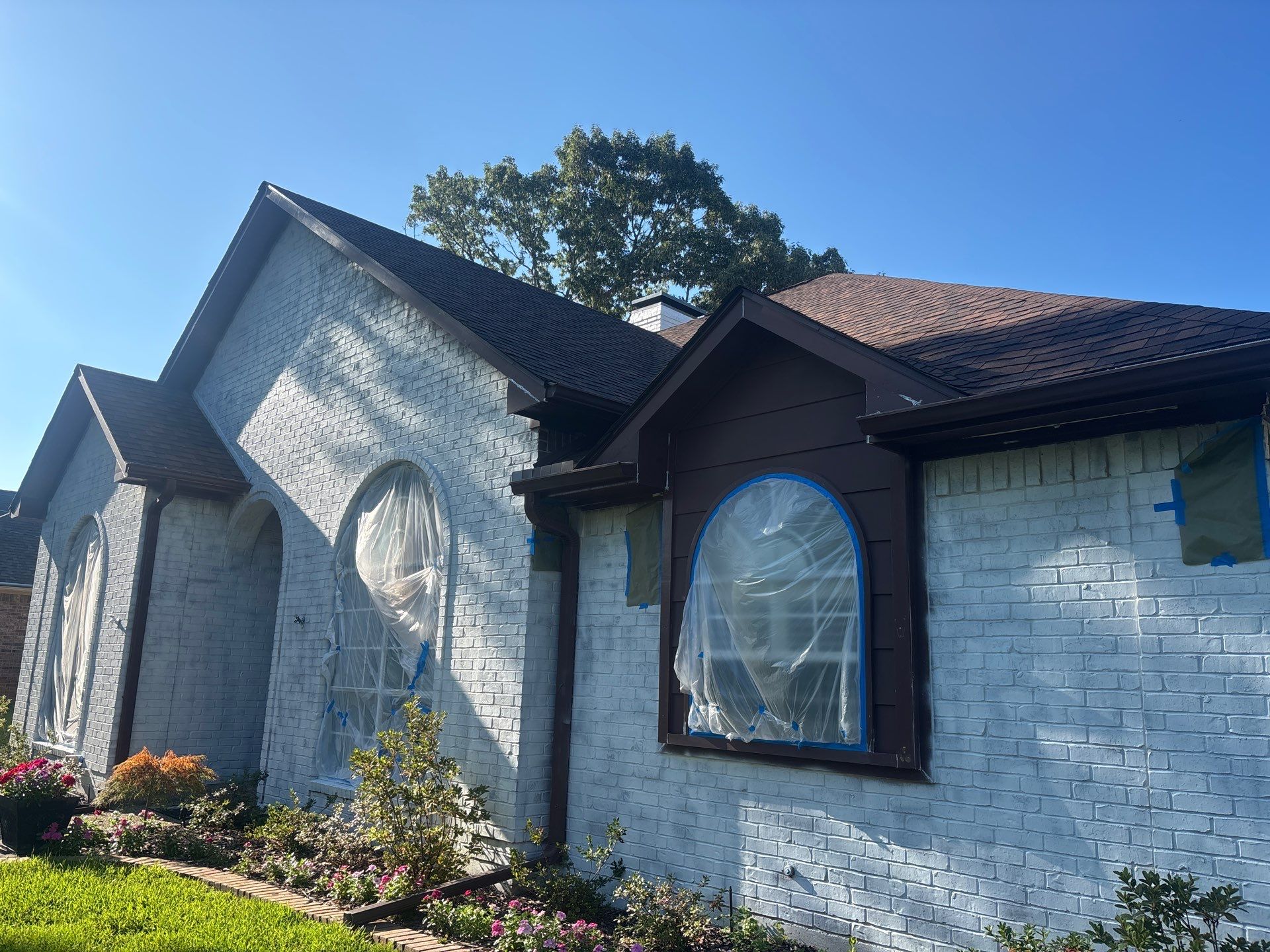 Project in TylerExterior Painting in Tyler, TX | White Brick Home, Varnished Fence & Shed Painting by Quality Coats Painting