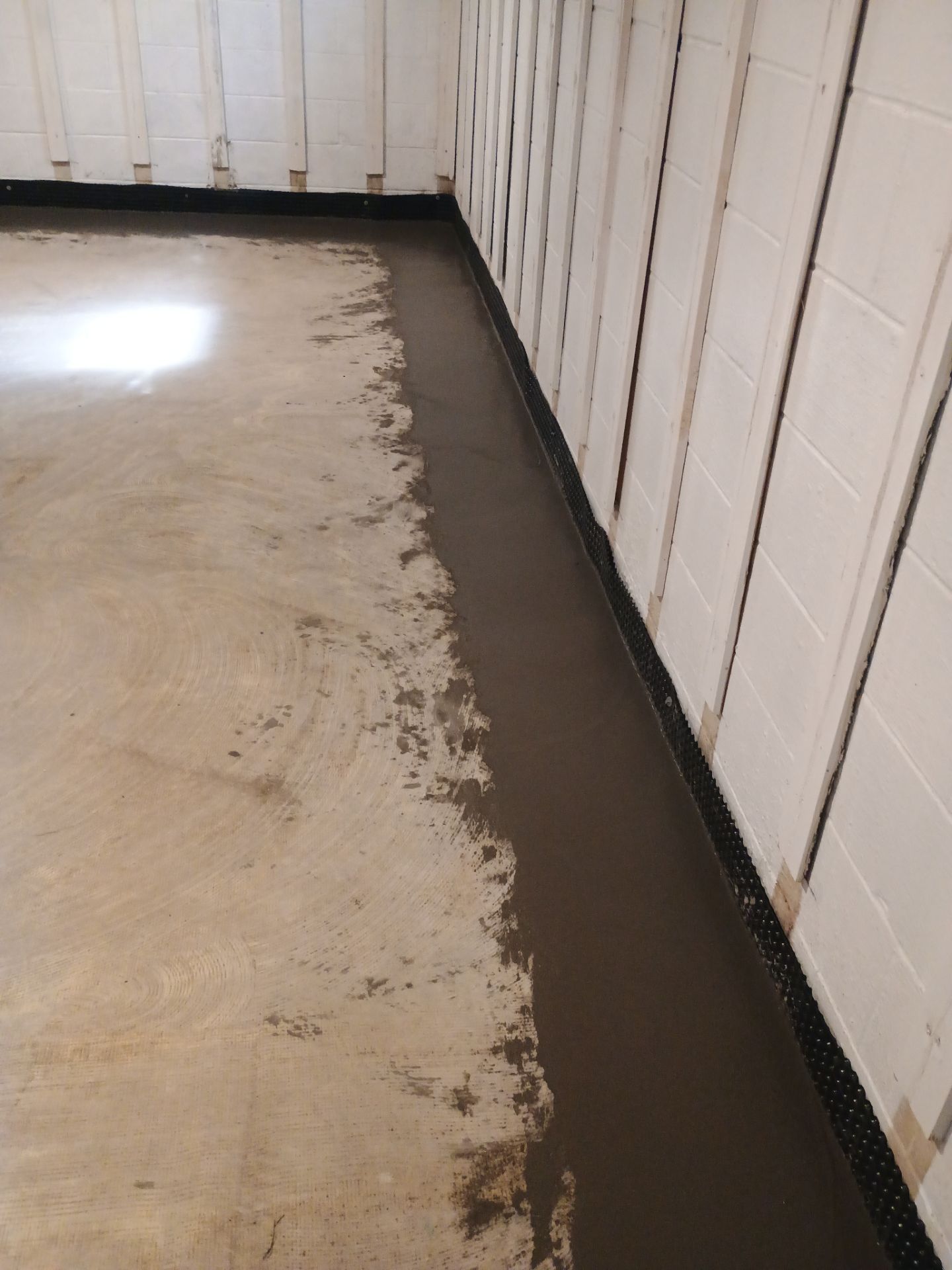 Interior Drain Tile & Buried Discharge in St. Anthony, MN by Waterproofing Northeast