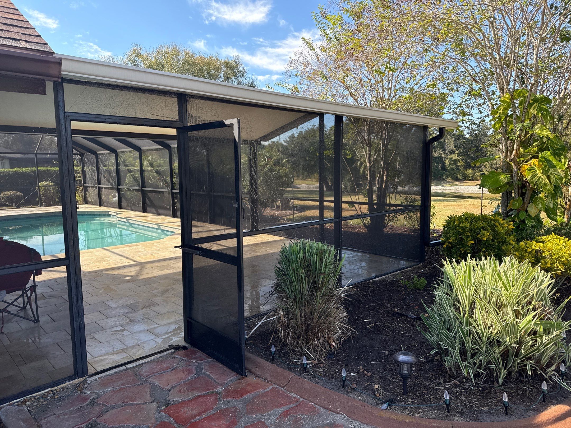Paver Pool Deck & Screen Enclosure Cleaning | River Wilderness, Parrish FL by Sunshine AquaWash