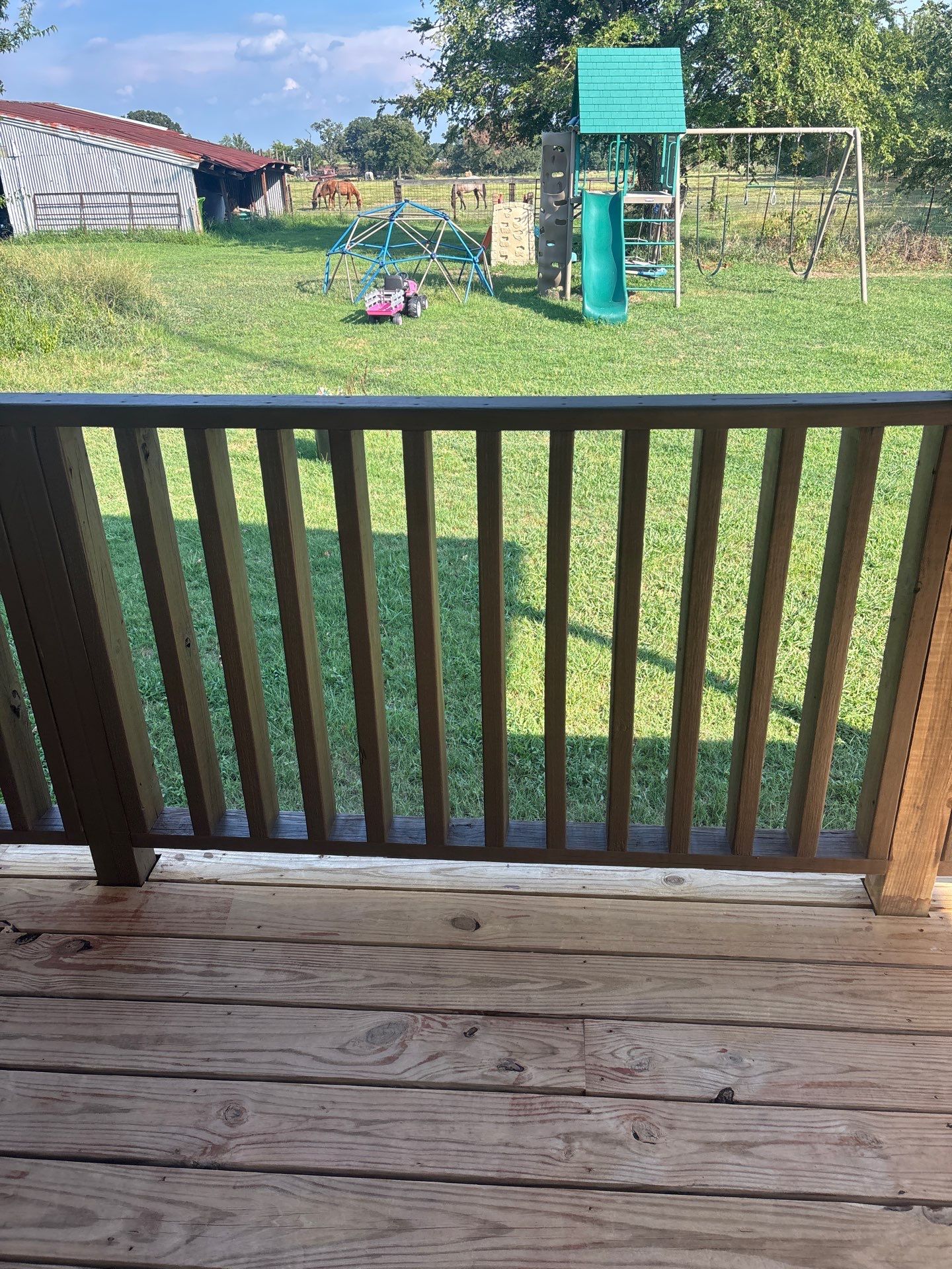 Exterior Painting in Fruitvale, TX | Wood Porch & Home in Deep Navy Blue by Quality Coats Painting