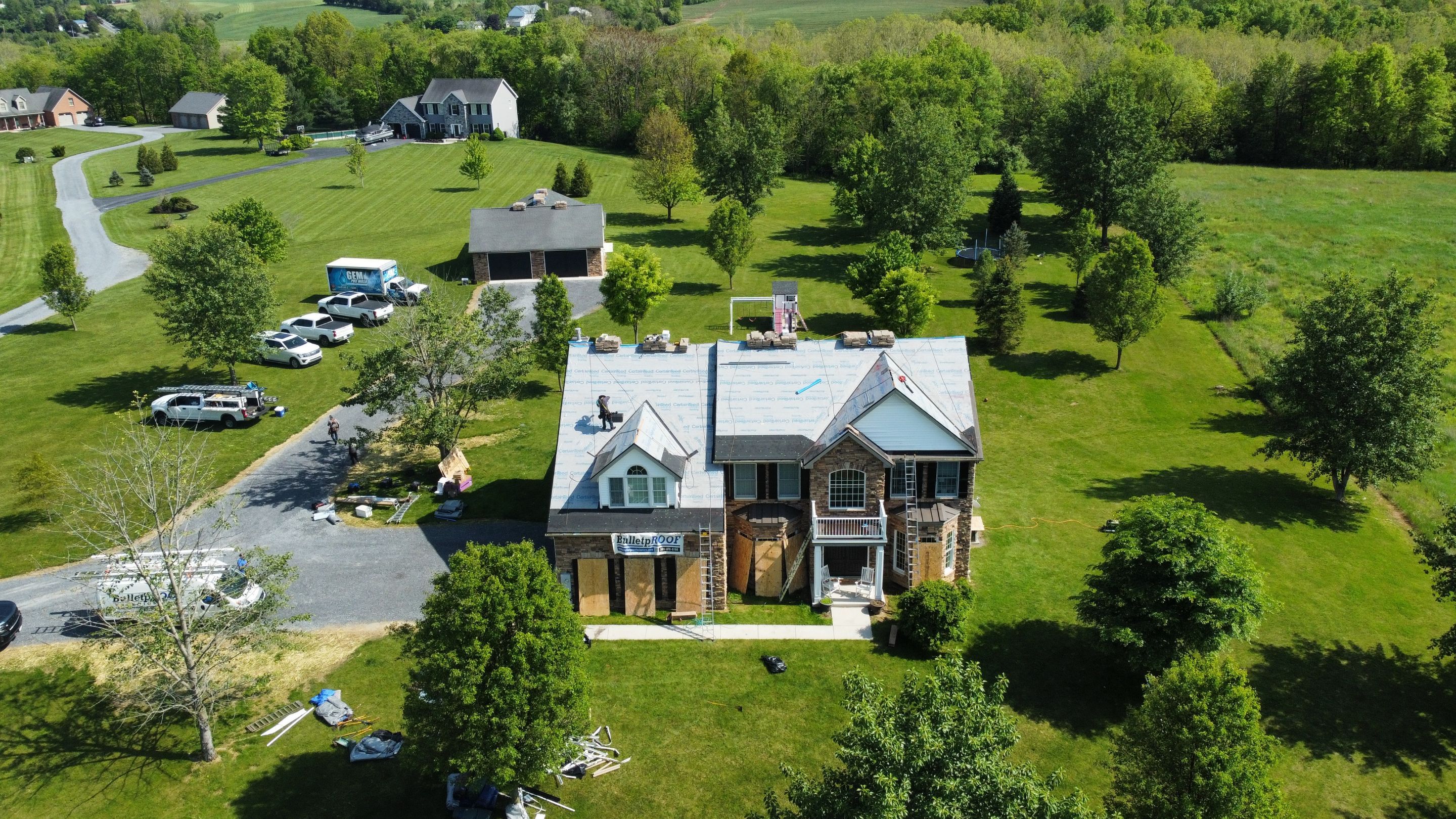 Roof Damage using Certainteed Lifetime Roofing System- Moire Black Landmark Pro shingkes with shadow ridge caps. by BulletpROOF Exteriors