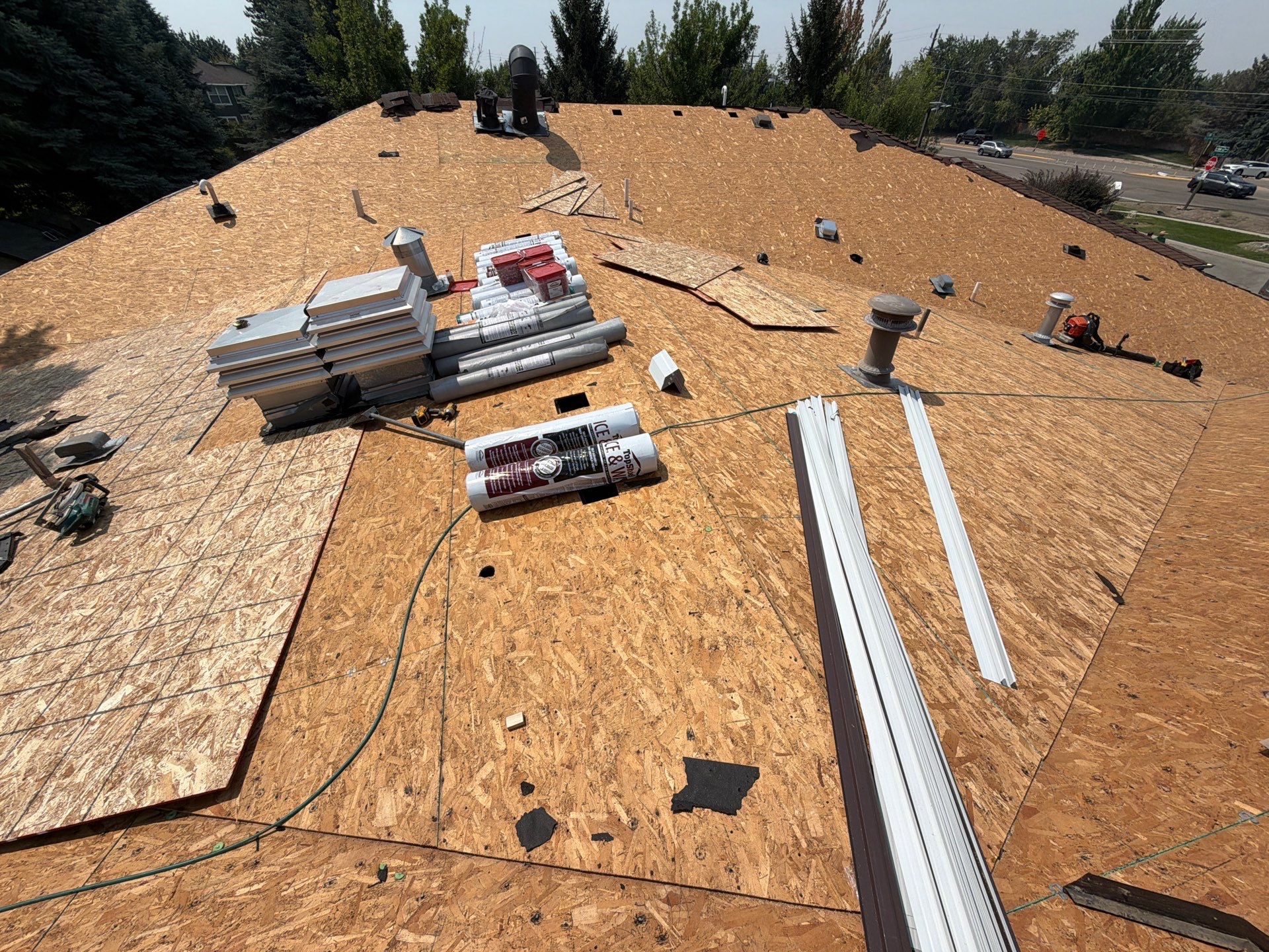 Boise Commercial Roof Replacement with Brown Architectural Shingles by Olive Roofing