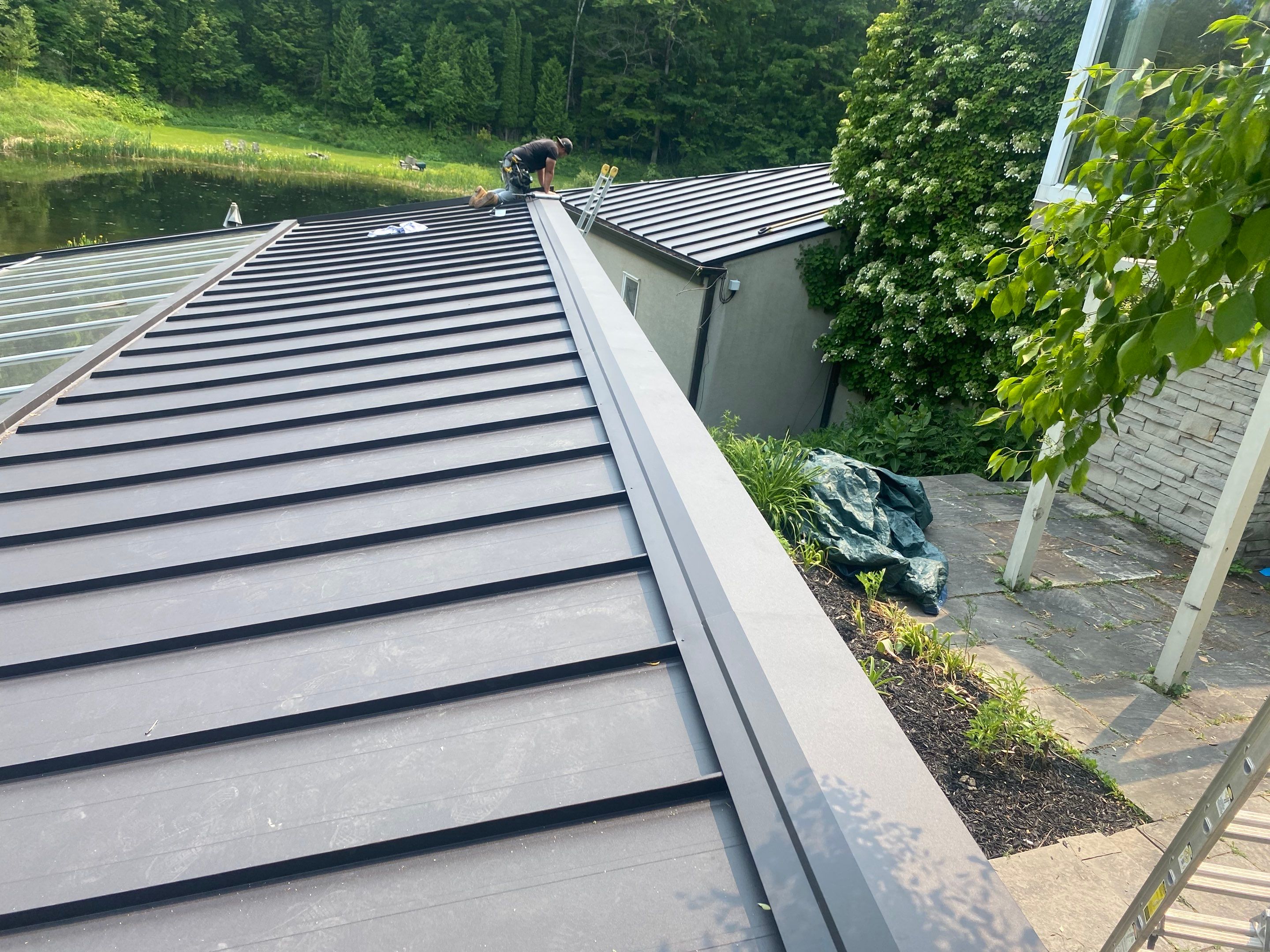 Roof Replacement using 16" Standing Seam Panels by Jay Carter Roofing & Sheet Metal