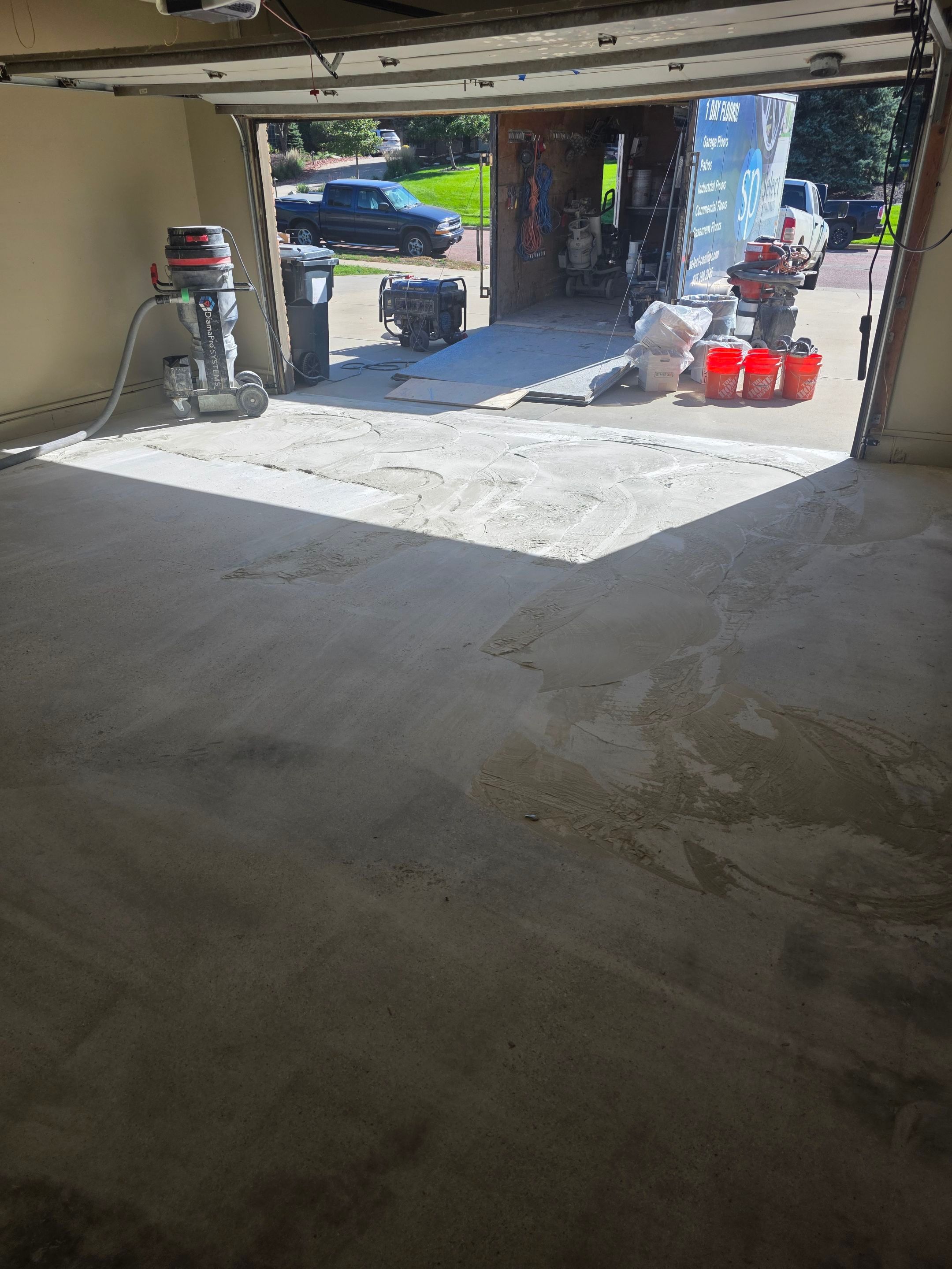 Residential Garage Epoxy Floor Coating Installation in Sioux Falls by Select Painting, Coatings & Garage Cabinets