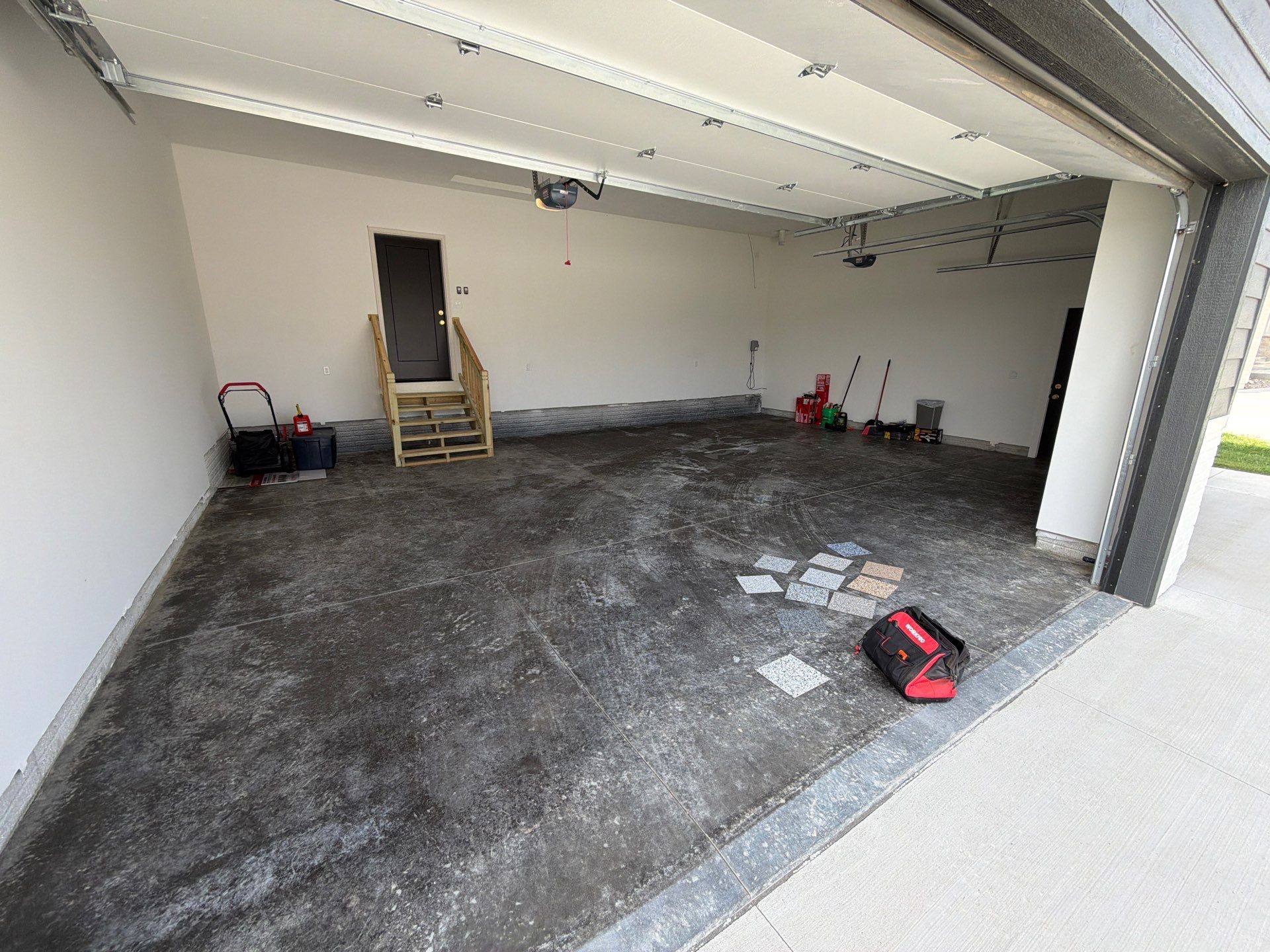Cabin Fever Decorative Flake Garage Floor Coating in Sioux Falls by Select Painting, Coatings & Garage Cabinets