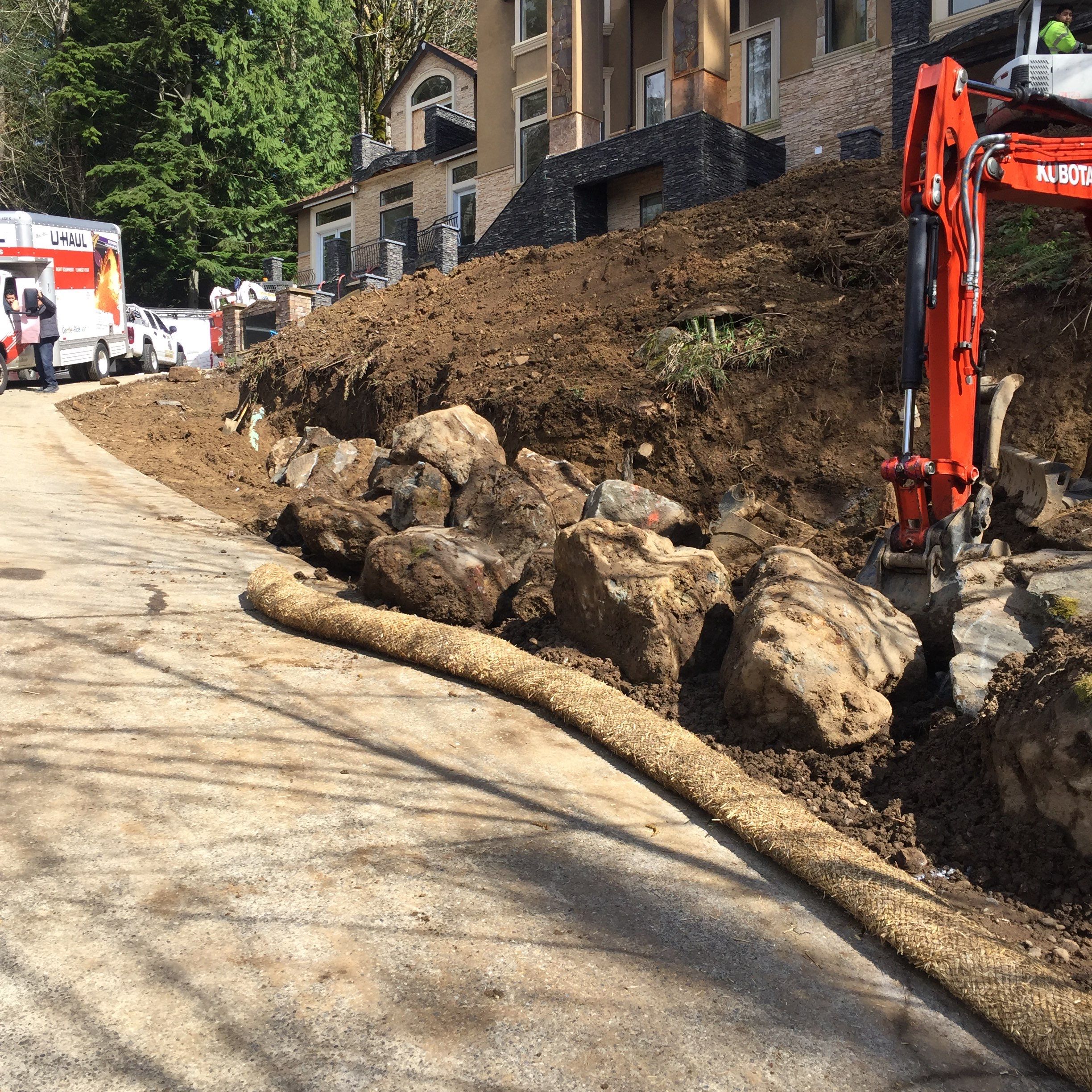 Asphalt Driveway and Stamped Concrete Patio Finish  by Jireh Asphalt & Concrete Inc 