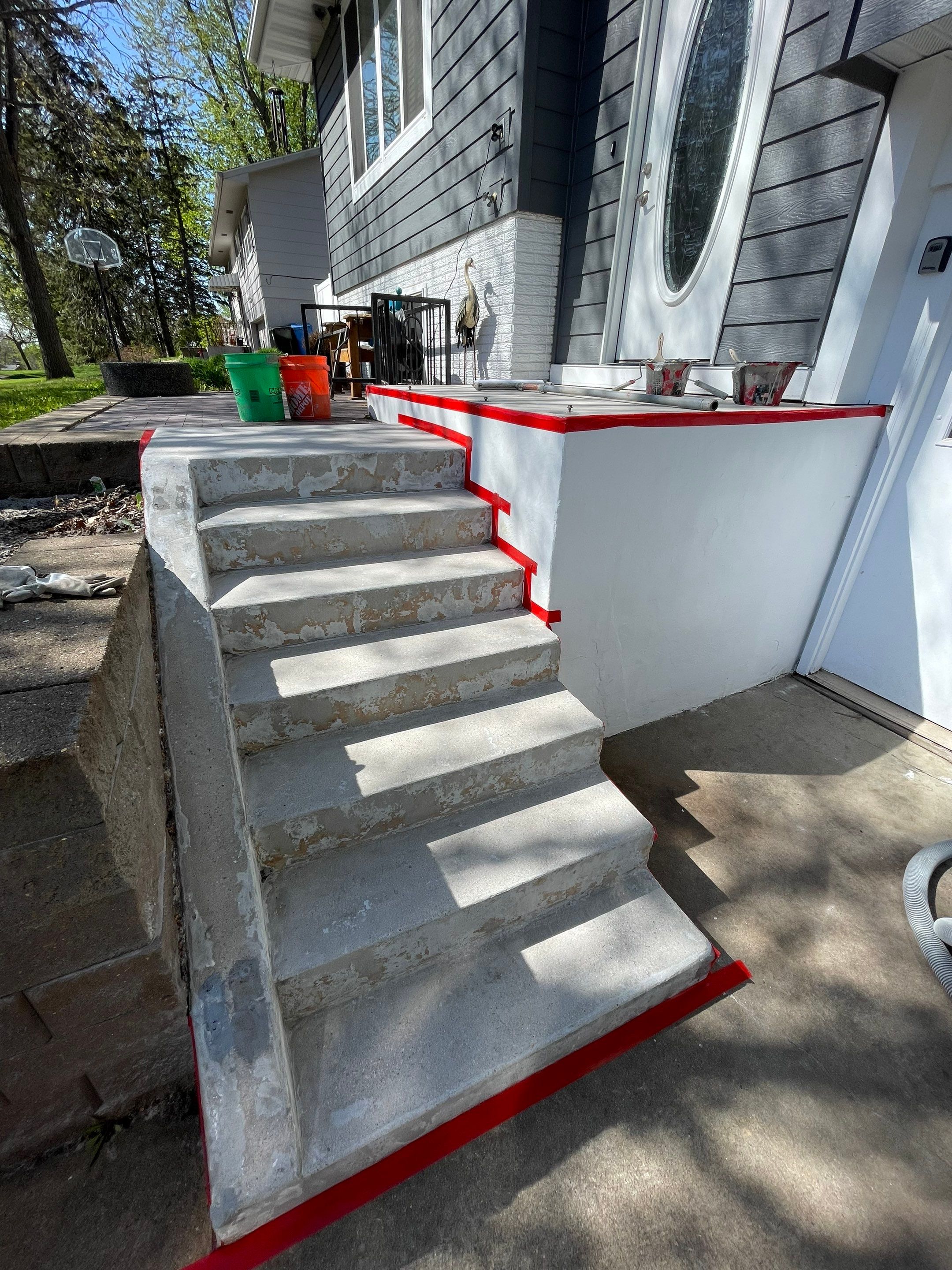 Grey Polyaspartic Porch and Stair Resurfacing in Sioux Falls by Select Painting, Coatings & Garage Cabinets