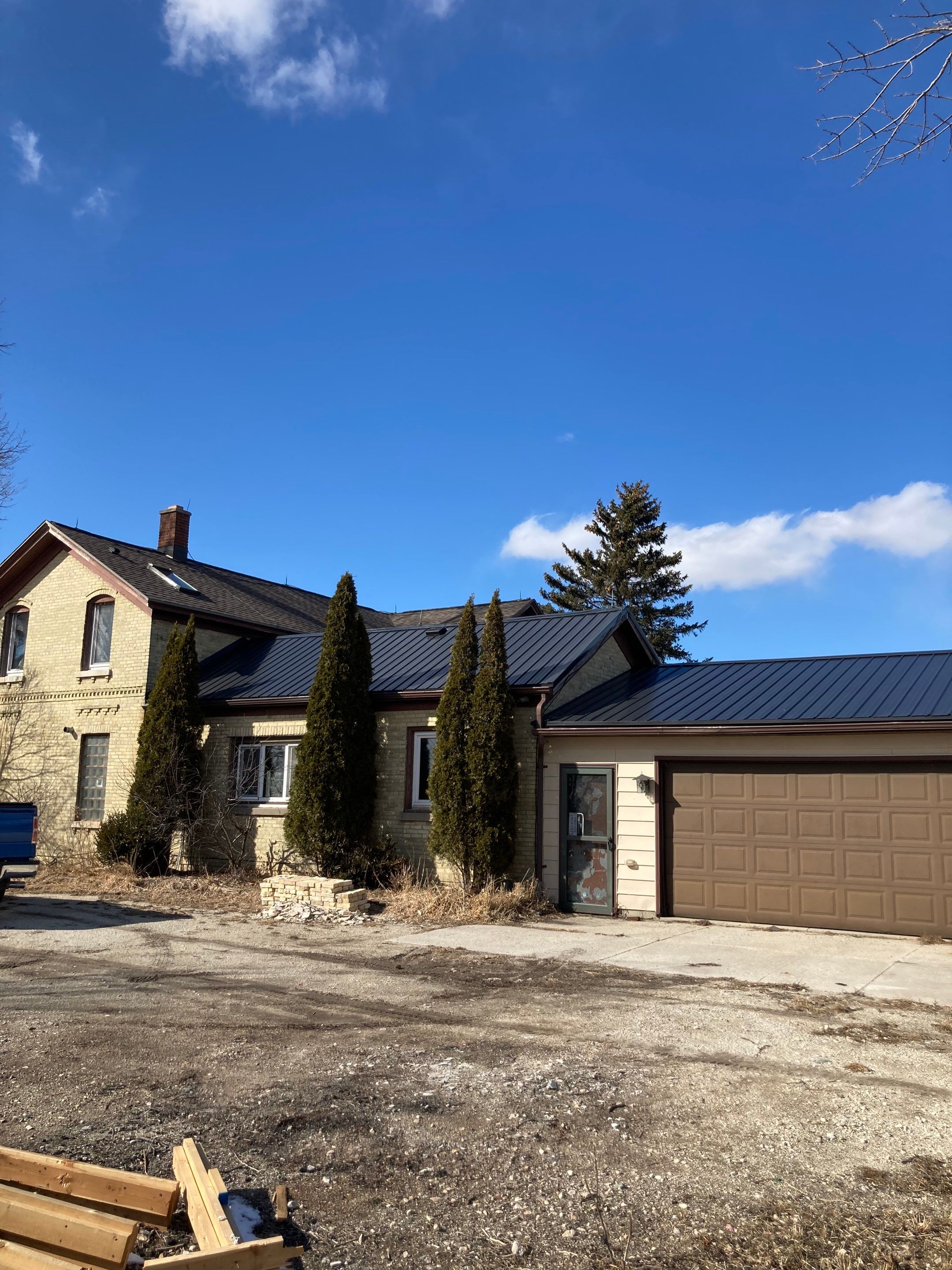  Metal Roof Installation on Residential Brick Home in Oostburg, WI by Gellings Roofing & Siding