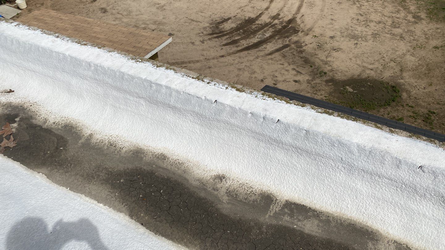 Polyurethane foam roof refurbish and recoating by Straight Edge Roofing Inc