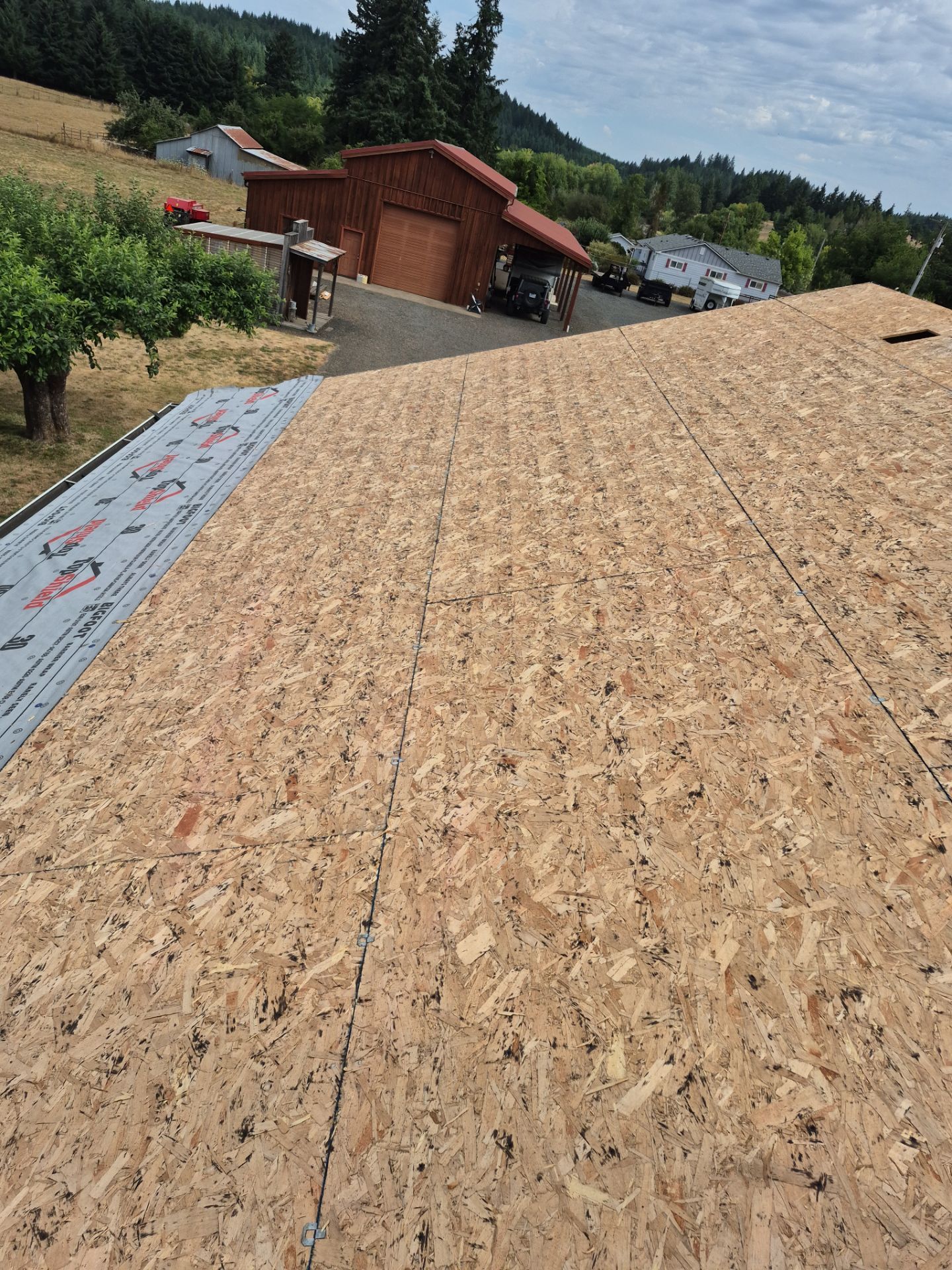 Residential Roof Replacement with Metal Accents by Orezona Building & Roofing Company, Inc.