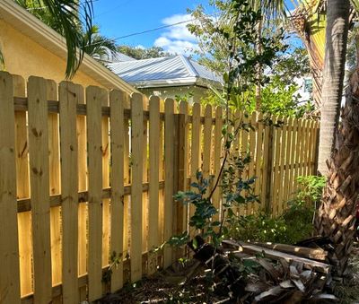 Wood Fence Installation using Wood Vertical Shadow Box