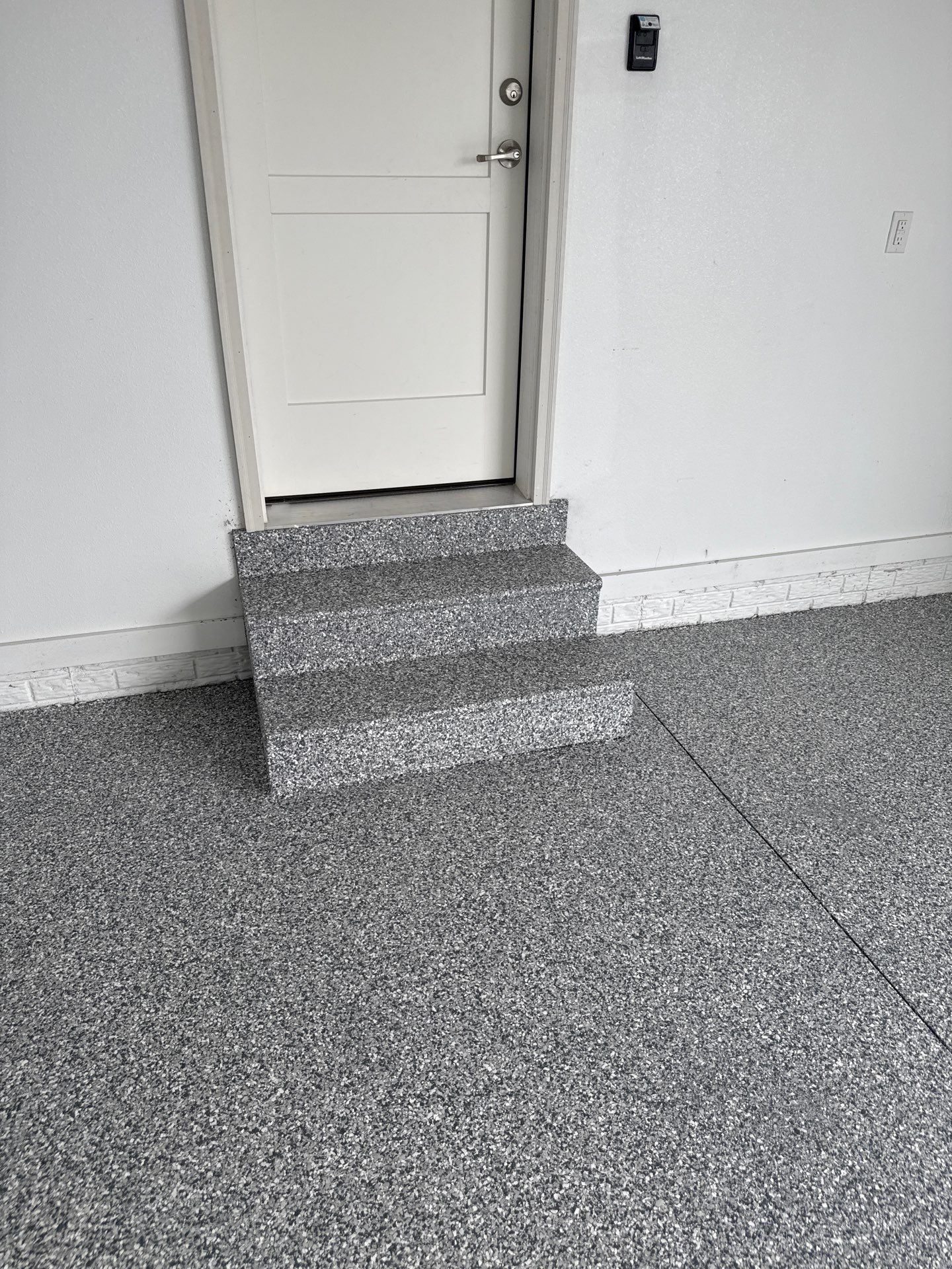 Gravel Flake Garage and Patio Floor Coating for Boone Residence by Revival Concrete Coatings