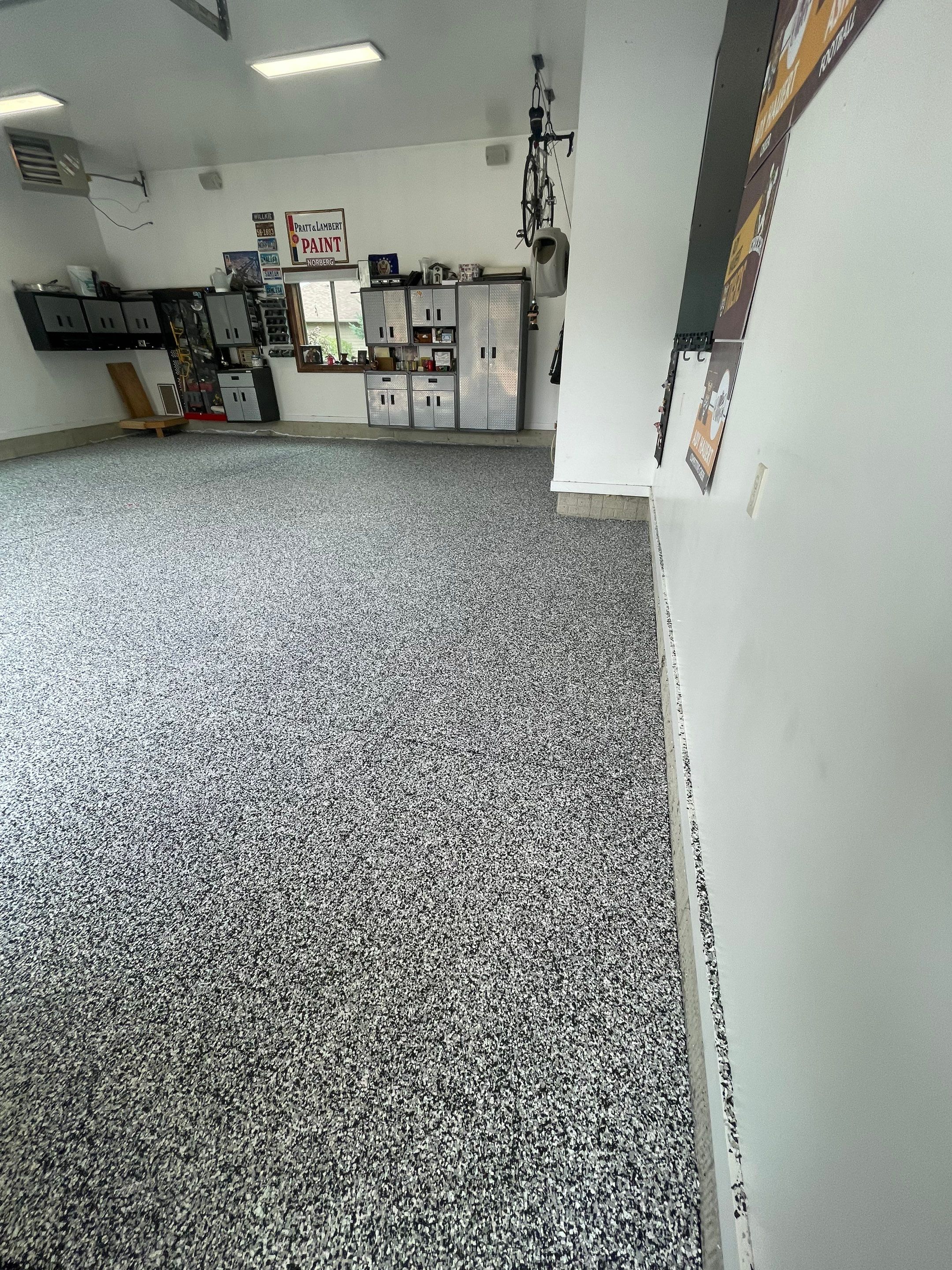 Garage Floor Coating and Domino Flake Finish in Sioux Falls by Select Painting, Coatings & Garage Cabinets