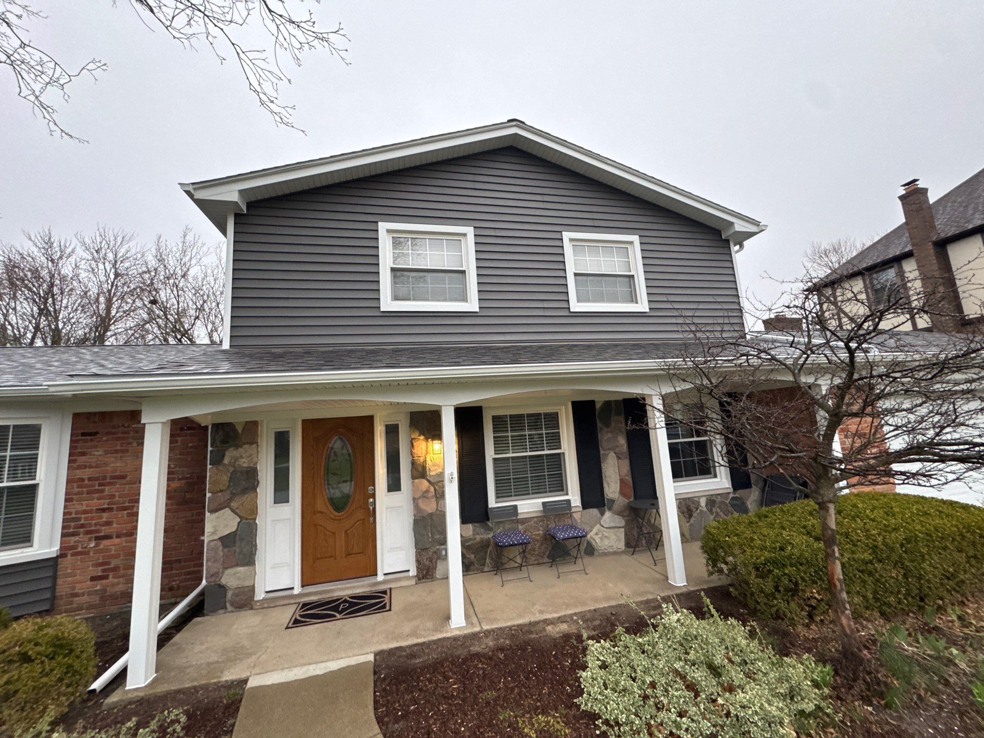 Siding Replacement using Alside Charcoal Smoke and Roof Replacement using Owens Corning Peppercorn by 180 Contractors