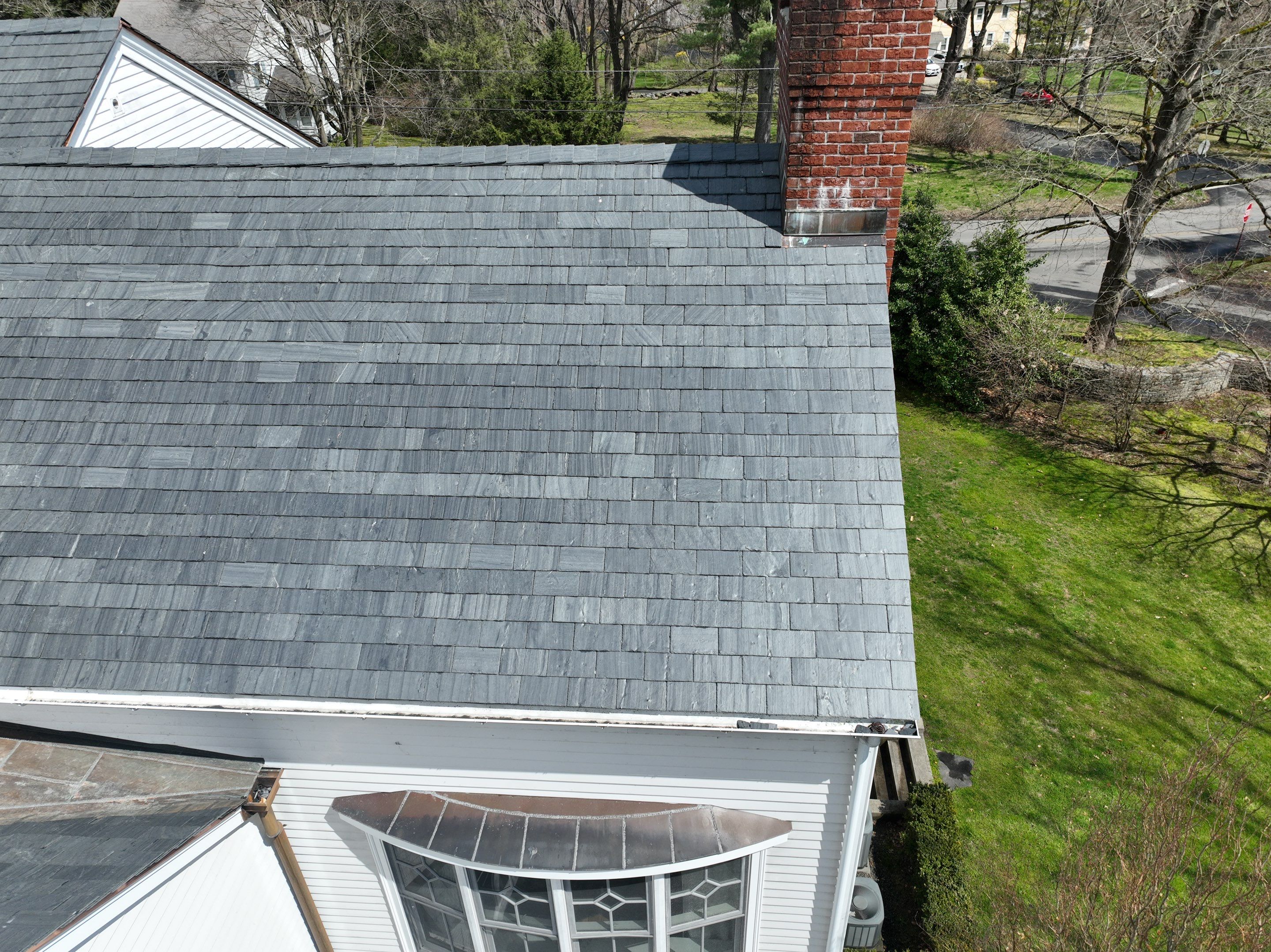 Residential Roofing Installation using Vermont Slate by A Plus Exterior