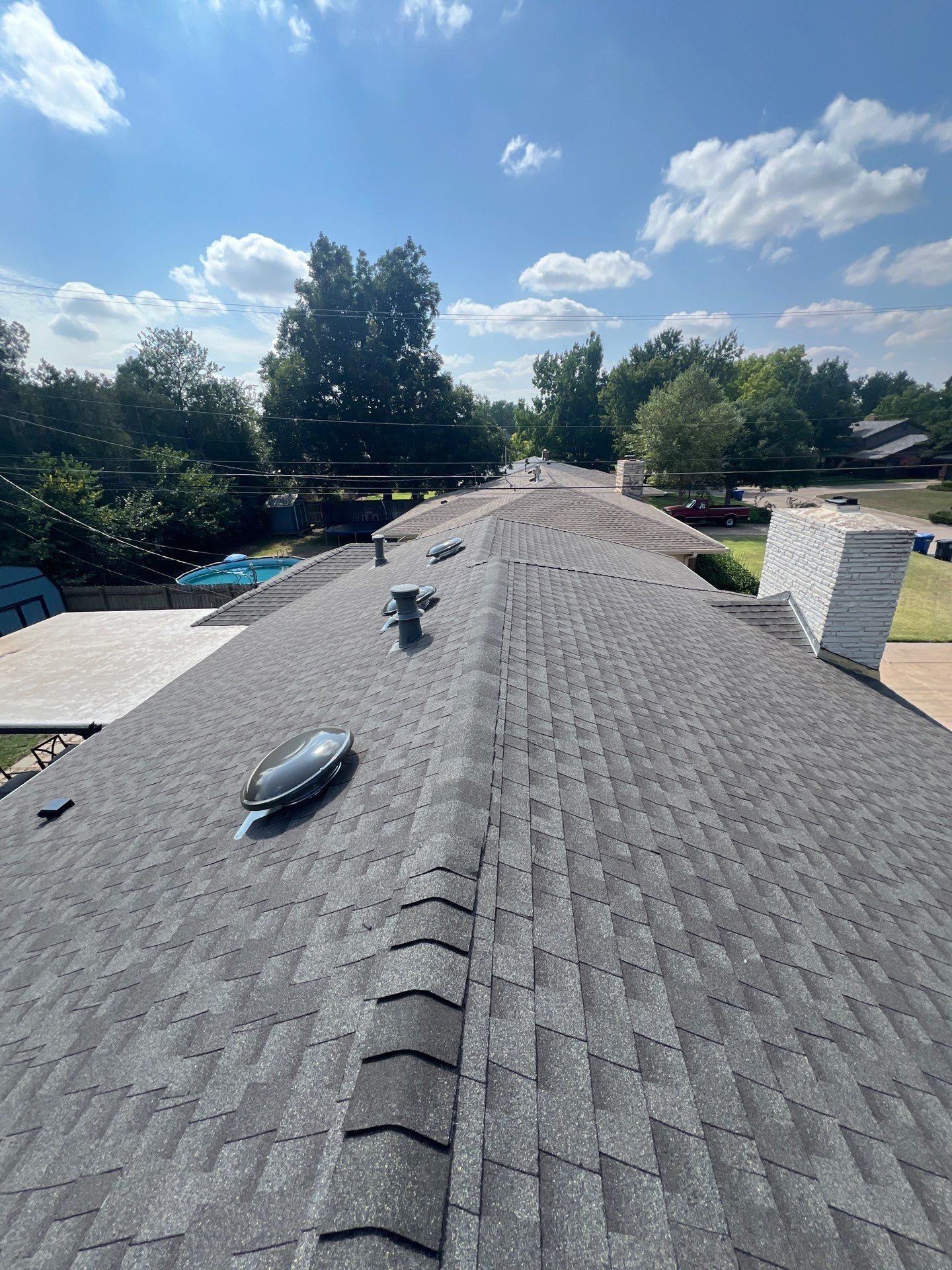 Roof Replacement and Gutter Installment in Enid, OK by McCann's Roofing and Construction
