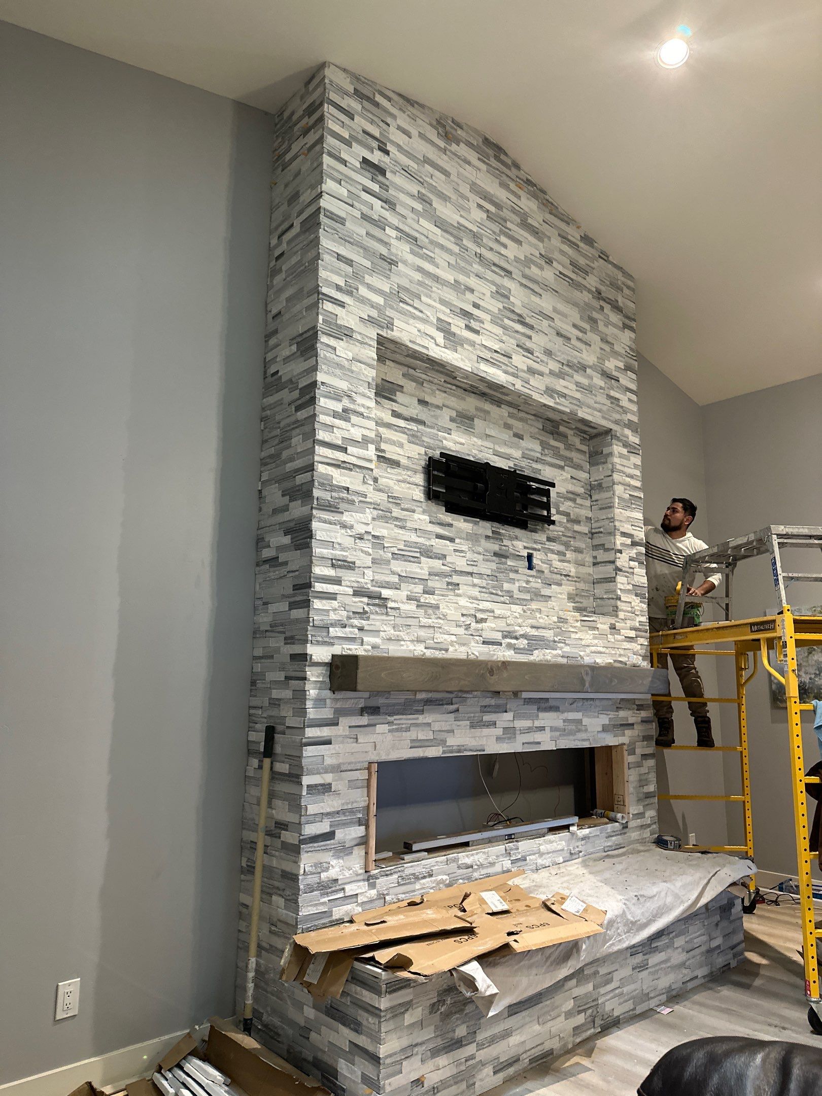 Stacked Stone Electric Fireplace by Footprints Floors of Chandler 